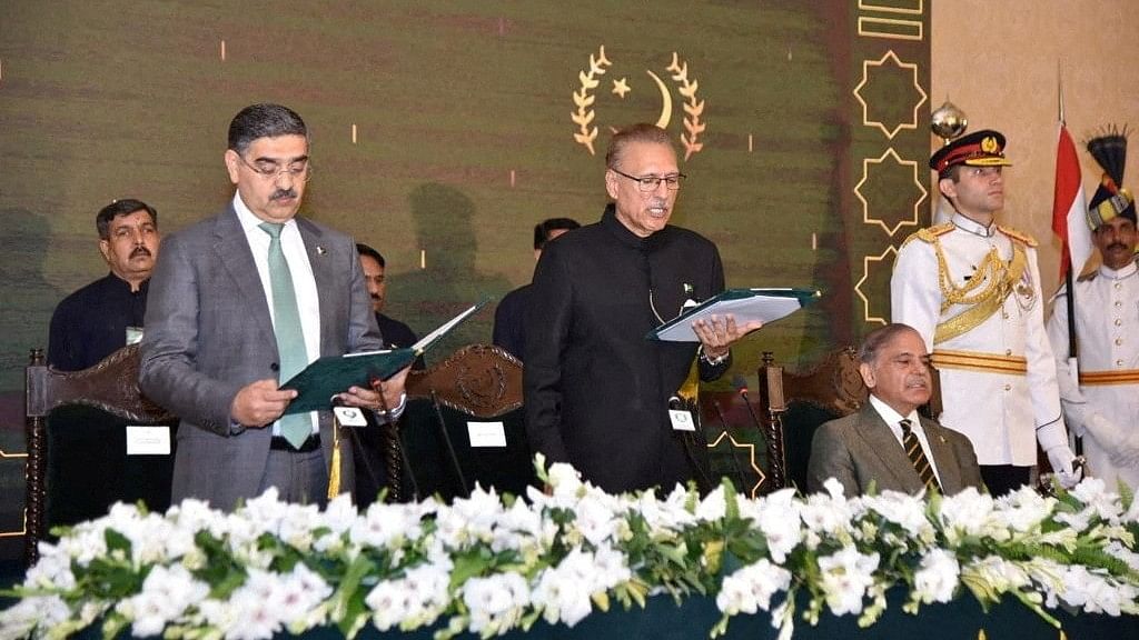 <div class="paragraphs"><p>Pakistan's caretaker Prime Minister Anwaar-ul-Haq Kakar takes oath from Pakistan's President Arif Alvi, in Islamabad.  </p></div>