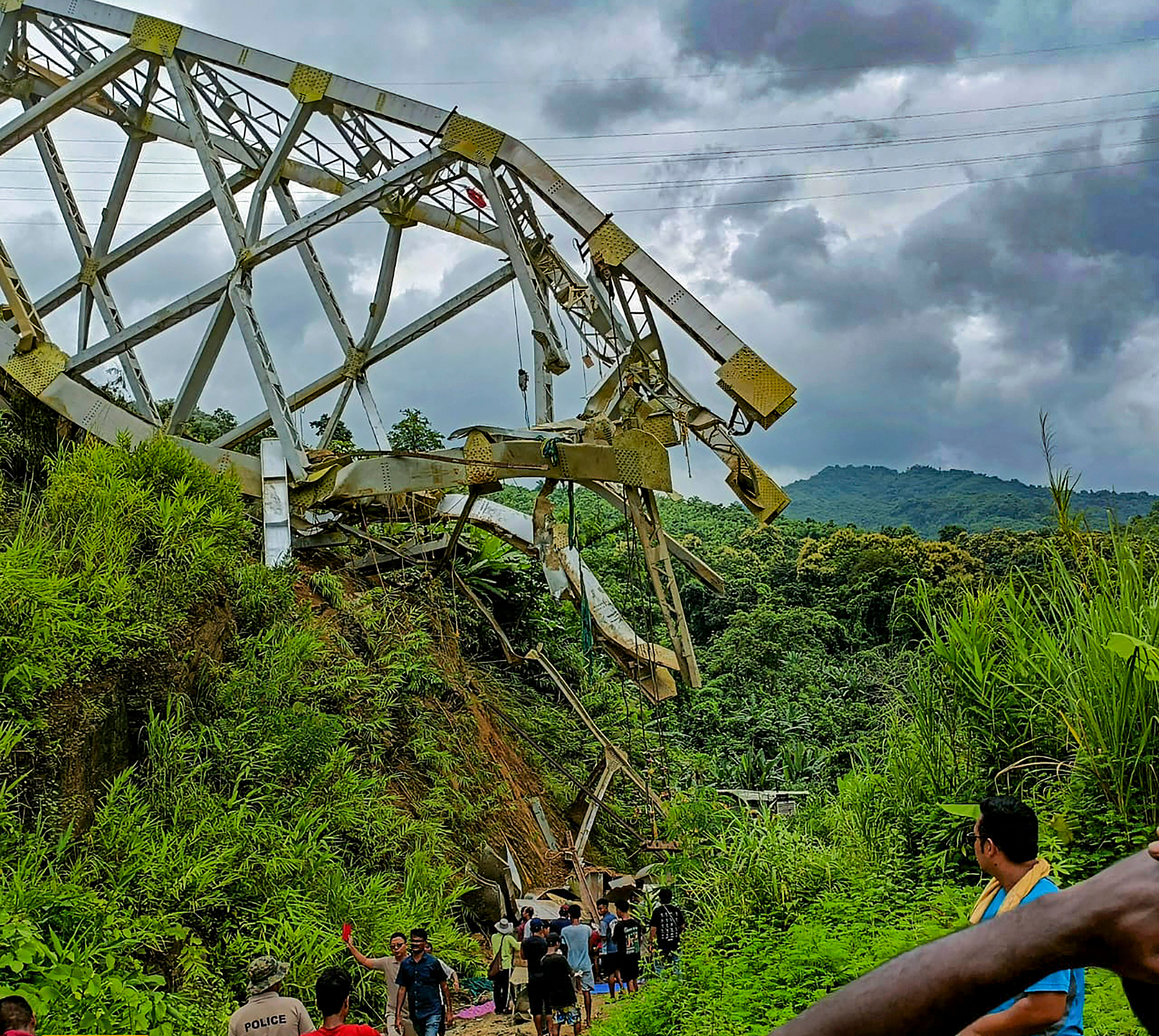 <div class="paragraphs"><p>Aizawl: Locals at the site after an under-construction railway bridge at Sairang area collapsed, near Aizawl, Mizoram, Wednesday, Aug. 23, 2023. </p></div>