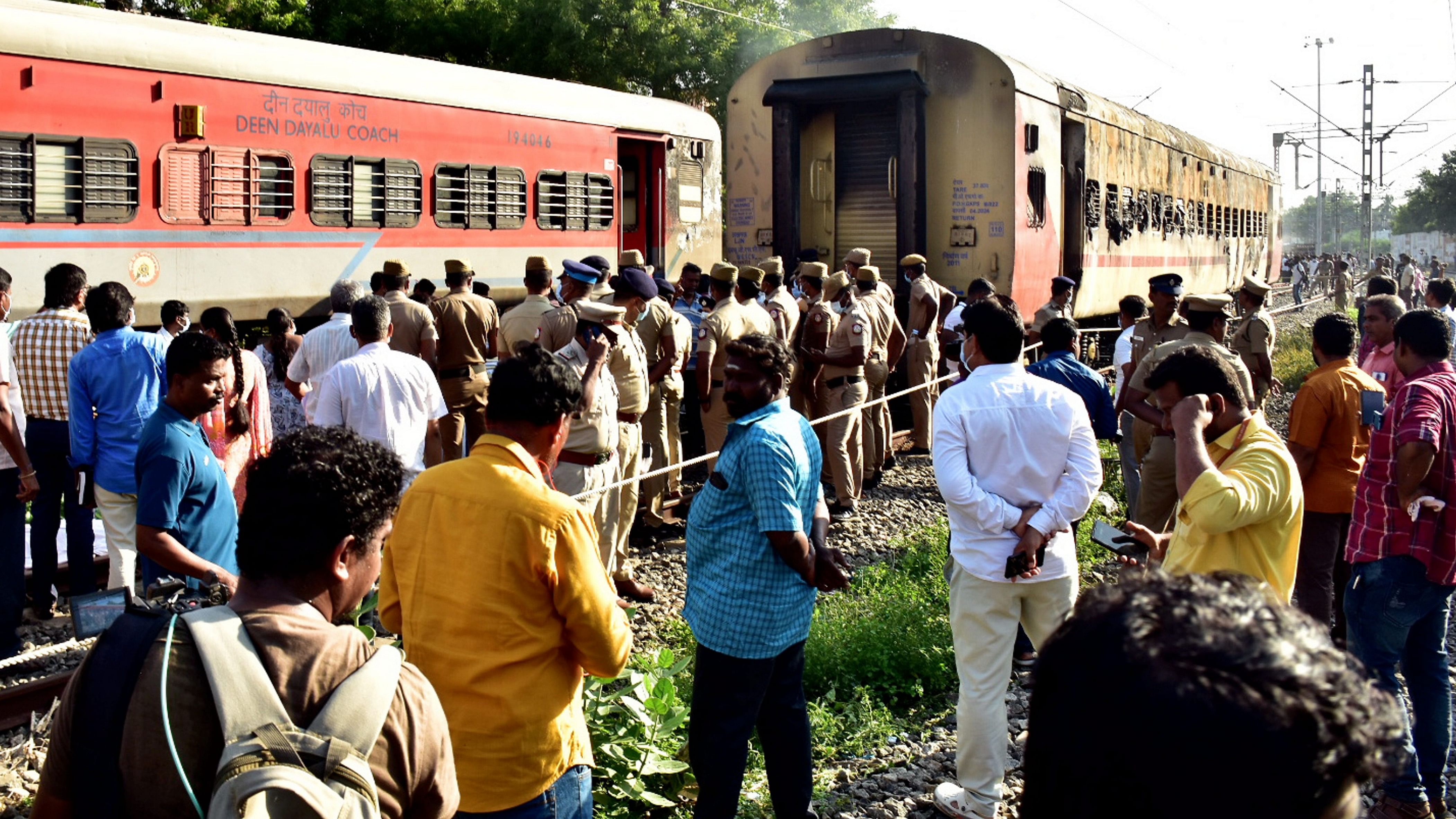 <div class="paragraphs"><p>Security personnel and other officials at the spot after a fire broke out in a coach of a train at Madurai railway station, Saturday, Aug. 26, 2023.</p></div>