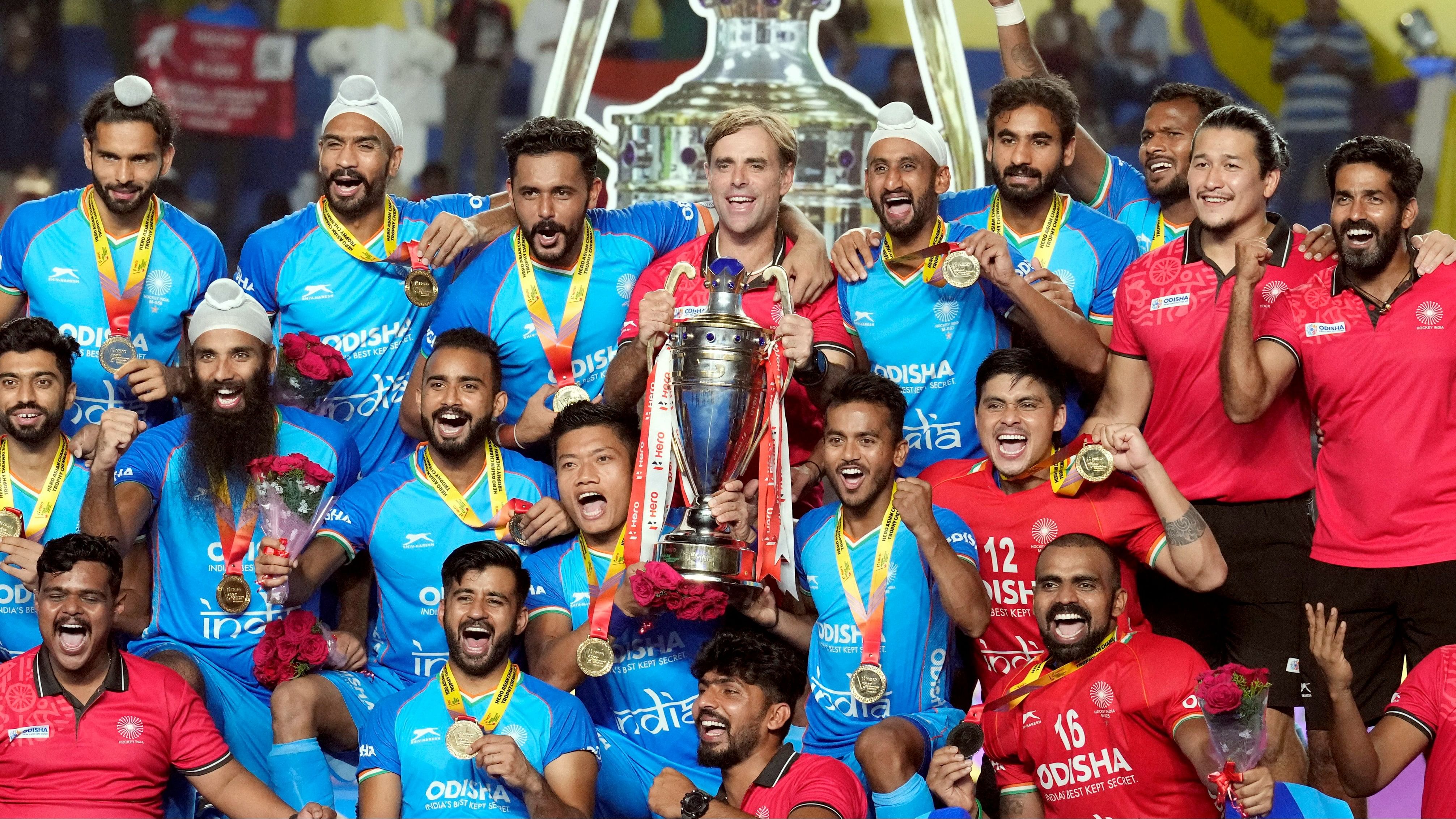 <div class="paragraphs"><p>Indian players and support staff pose with the trophy after winning the Asian Champions Trophy 2023, in Chennai, Saturday, Aug. 12, 2023. India beat Malaysia 4-3 in the final to claim their fourth Asian Champions Trophy title.</p></div>