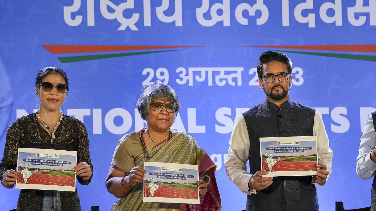 <div class="paragraphs"><p>Union Minister of Youth Affairs and Sports Anurag Singh Thakur with Sports Secretary Sujata Chaturvedi and boxer Mary Kom releases a publication during the National Sports Day event at JLN Stadium in New Delhi, Tuesday, Aug. 29, 2023.</p></div>