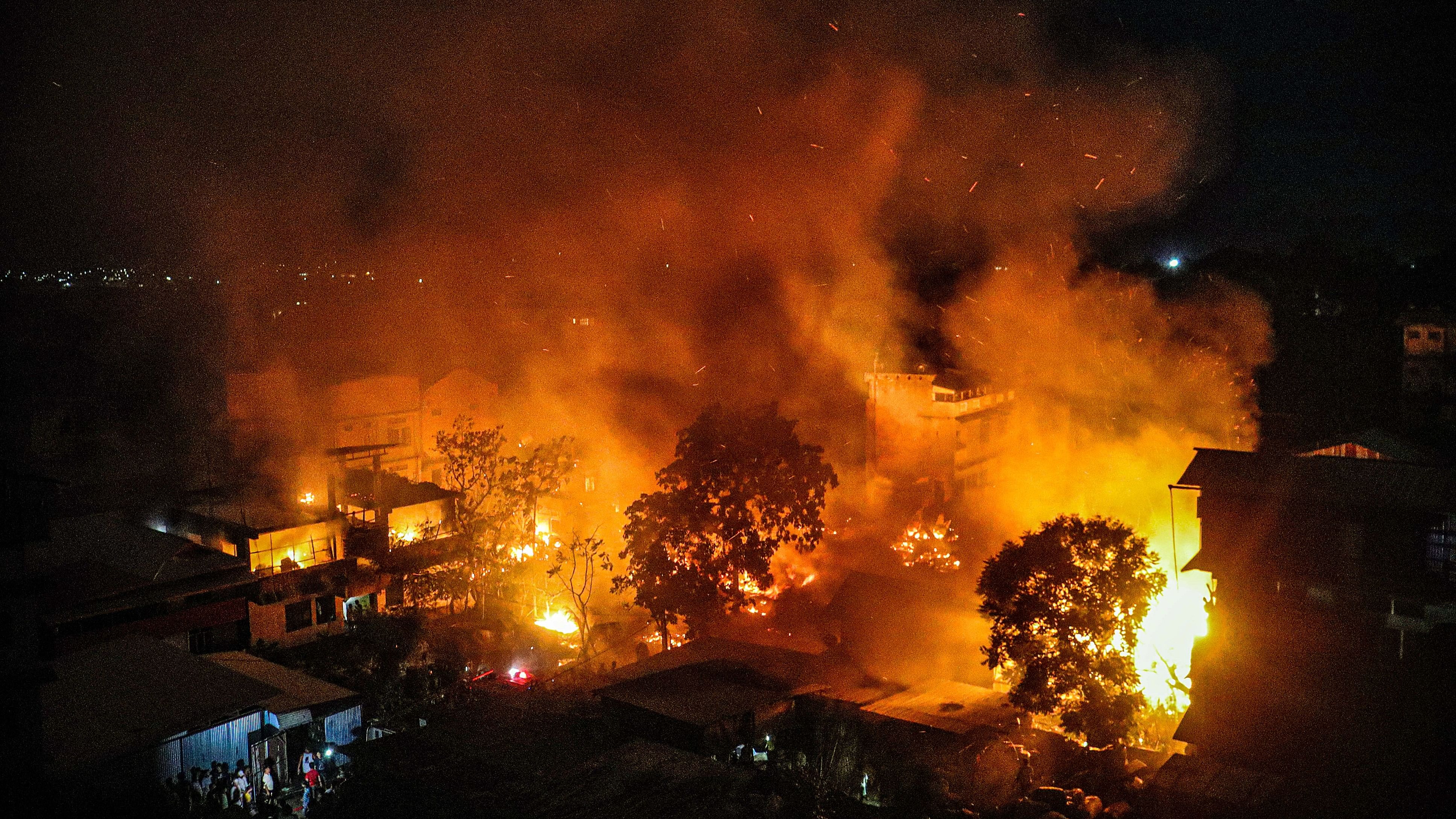 <div class="paragraphs"><p>Smoke and flames seen after the houses of Kuki-Zo community were set on fire by miscreants in the violence-hit Manipur, in imphal, Tuesday, Aug 1, 2023. </p></div>