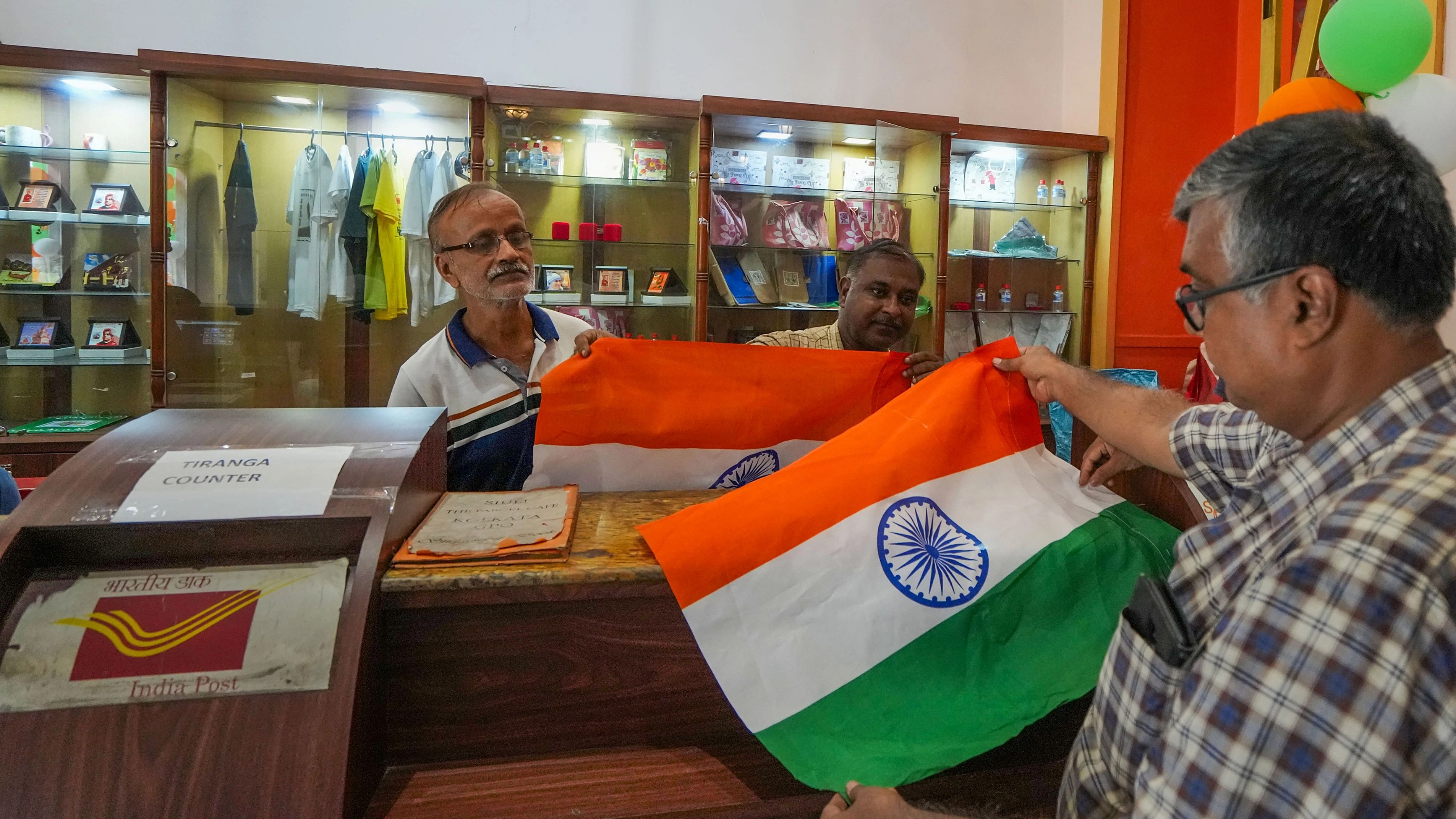 <div class="paragraphs"><p>People purchase the national flags at G.P.O. in Kolkata, Friday, Aug. 11, 2023. </p></div>