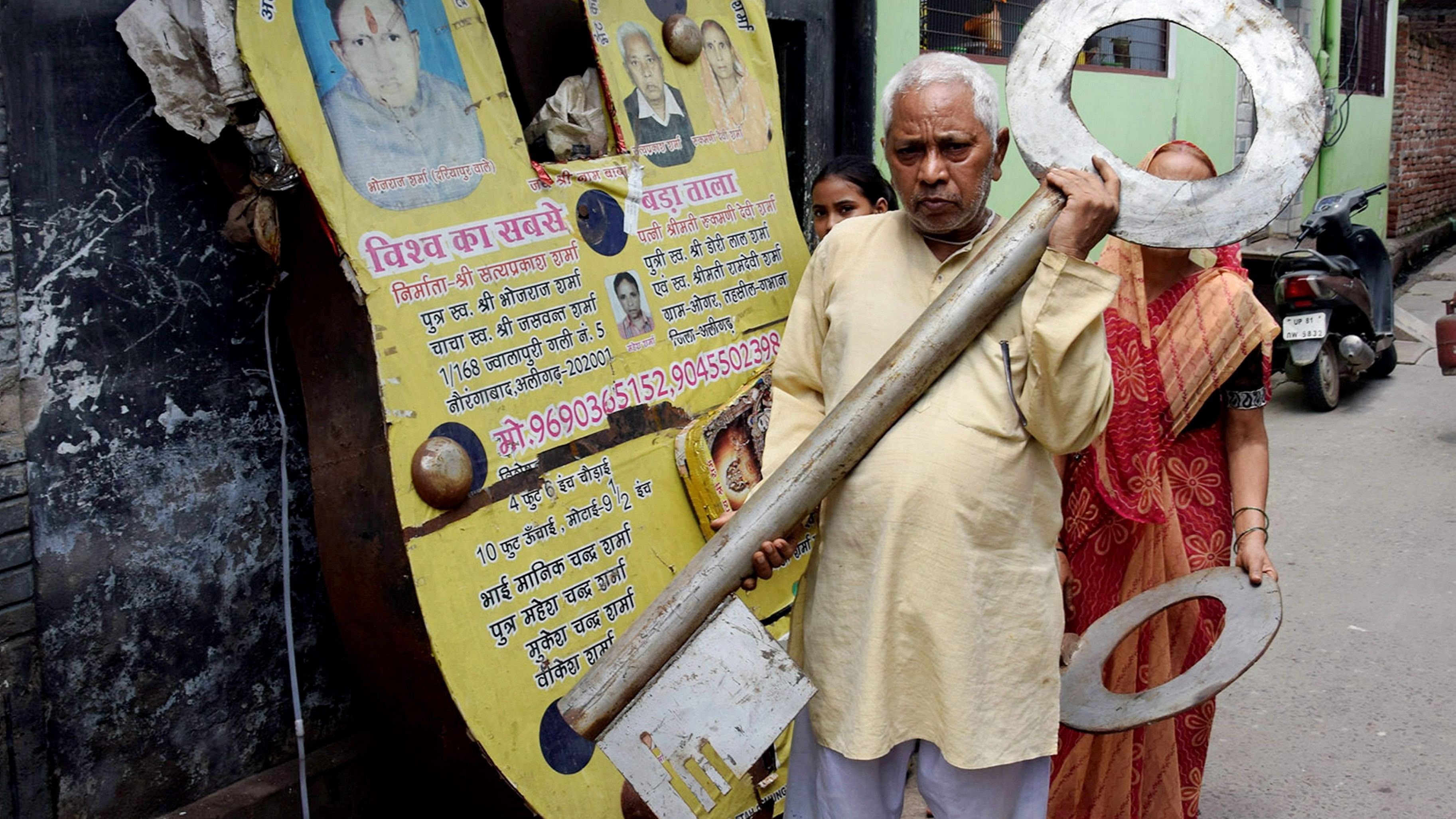 <div class="paragraphs"><p>Satya Prakash Sharma, an elderly artisan from Aligarh, carries the key of a 400 kg lock which he has made for Ayodhya's Ram Mandir.&nbsp;</p></div>