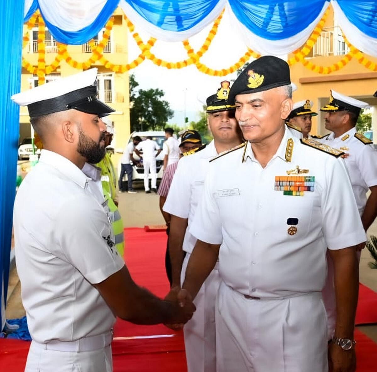 An Indian Navy officer greets Chief of the Naval Staff Admiral R Hari Kumar on board INS Kadamba in Karwar on Wednesday.