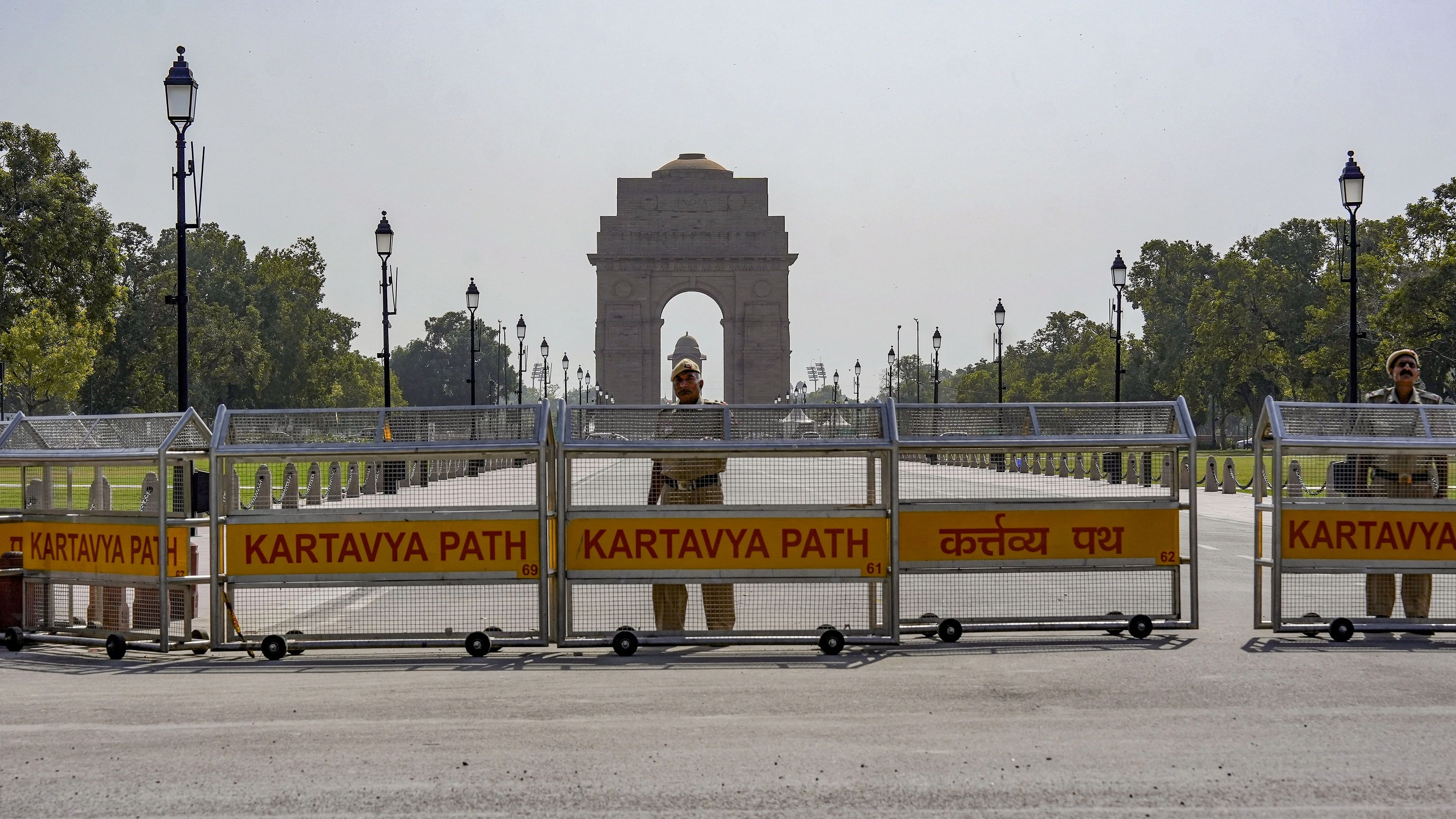 <div class="paragraphs"><p>Police official stands guard at the barricaded Kartavya Path near the India Gate.</p></div>