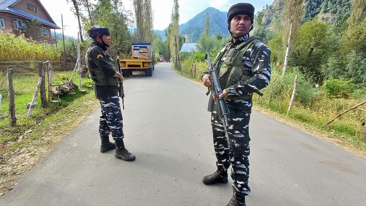 <div class="paragraphs"><p>Security personnel stand guard near the site of an encounter with terrorists at Kokernag area, in Anantnag district, Saturday, Sept. 16, 2023.</p></div>