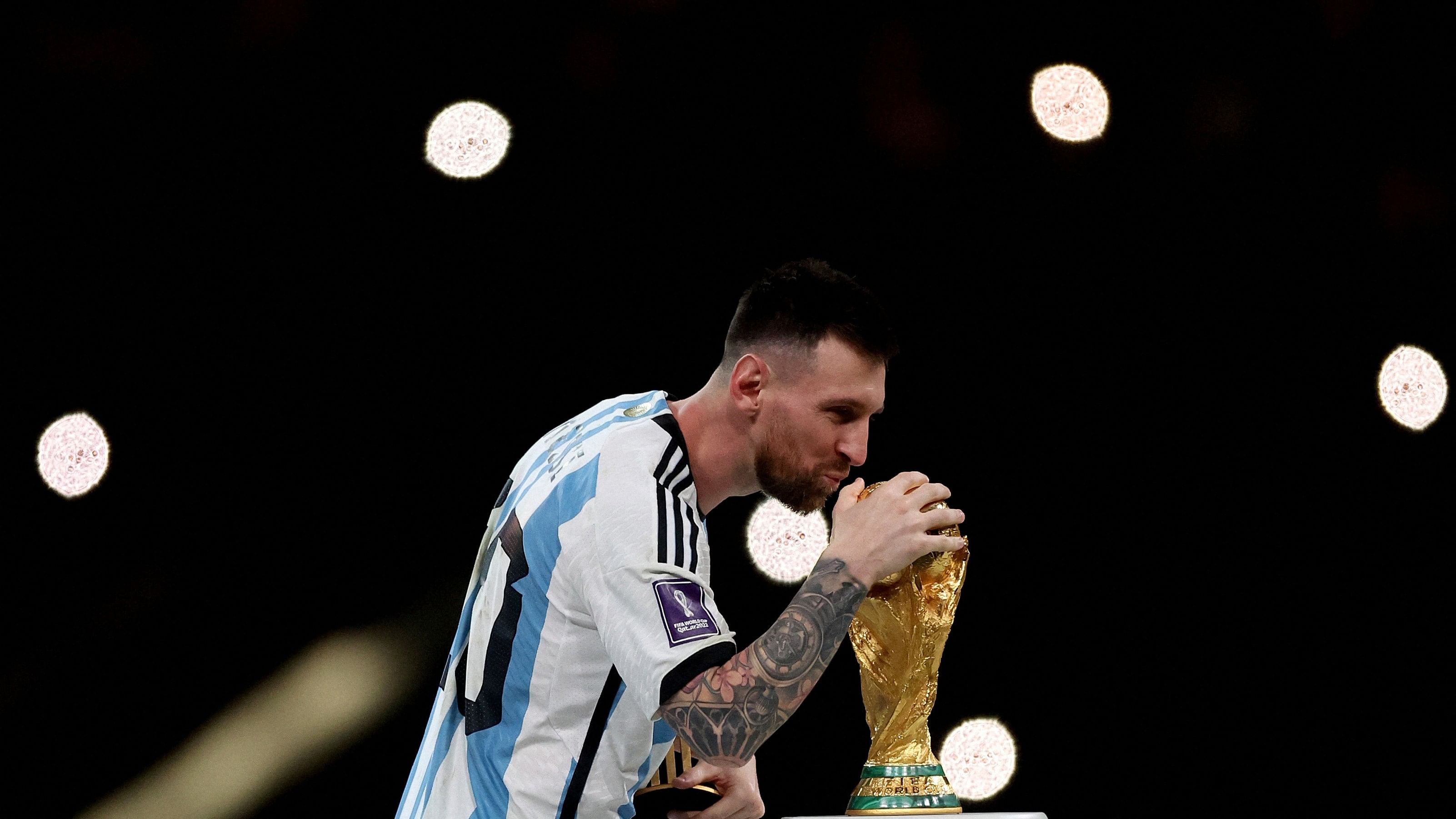 <div class="paragraphs"><p> Lionel Messi  with the trophy after winning the World Cup.</p></div>