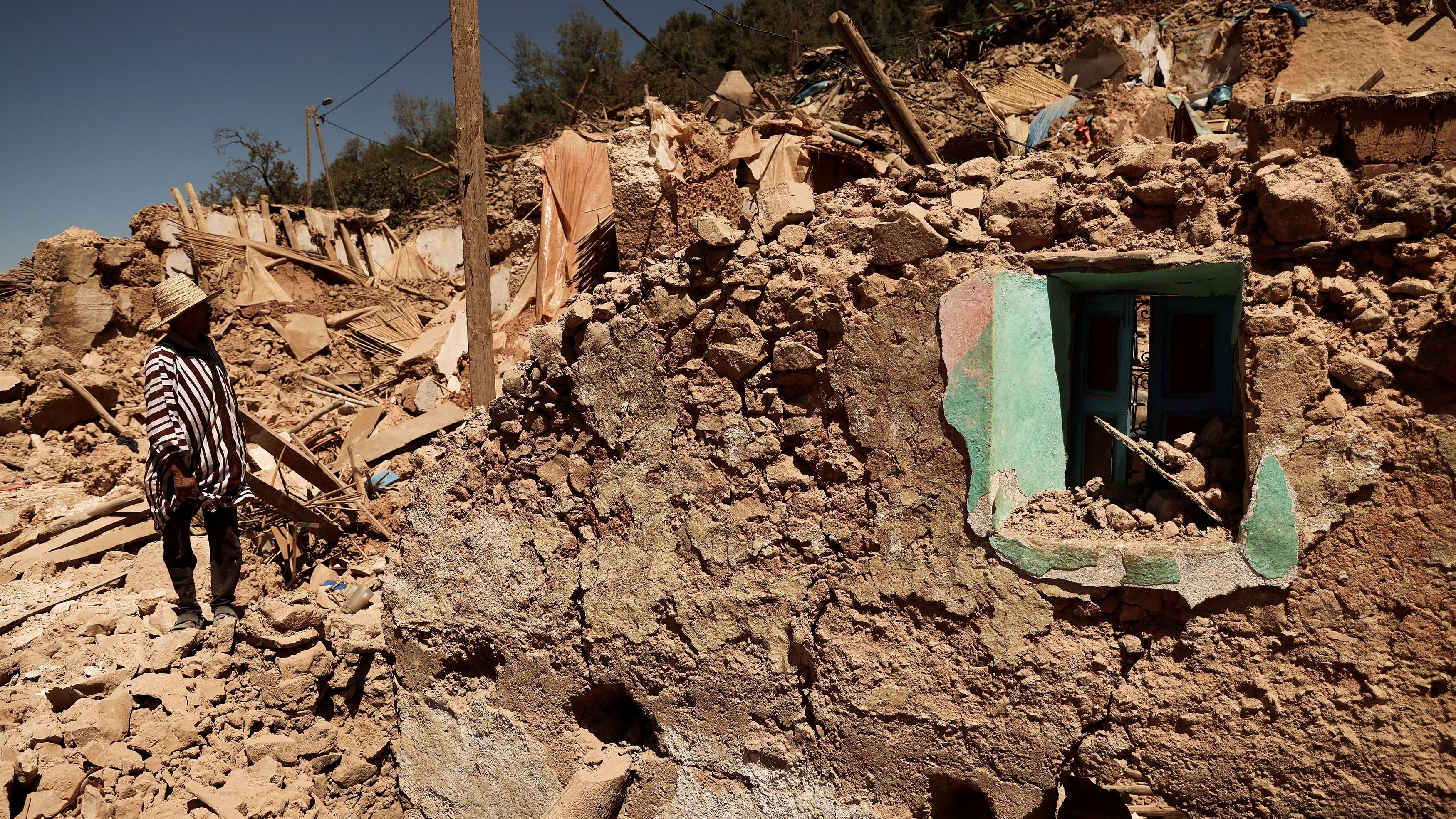 <div class="paragraphs"><p>Mohamed Ouchen, 66, a survivor, who helped to pull his sister and her husband with their children from rubble, looks at his destroyed house, in the aftermath of a deadly earthquake, in Tikekhte, near Adassil, Morocco</p></div>