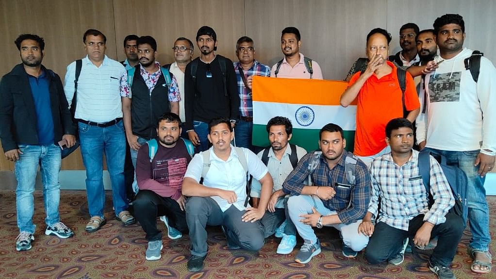 <div class="paragraphs"><p>The sailors brought back from Yemen pose with the Indian flag.</p></div>