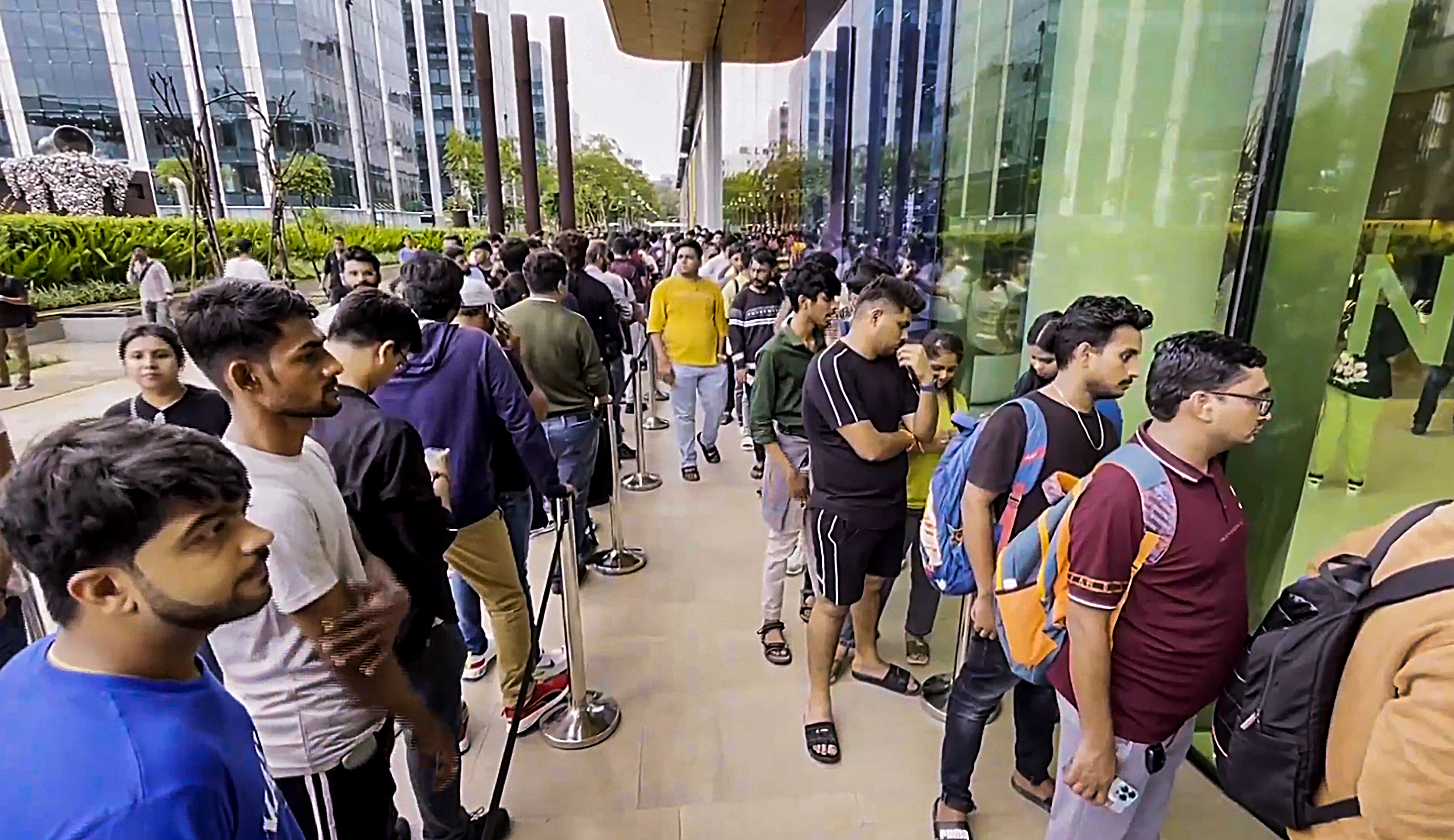 <div class="paragraphs"><p>Customers stand in a queue outside an Apple retail store as the newly-launched iPhone 15 series goes on sale in India, at BKC in Mumbai, Friday, Sept. 22, 2023.</p></div>