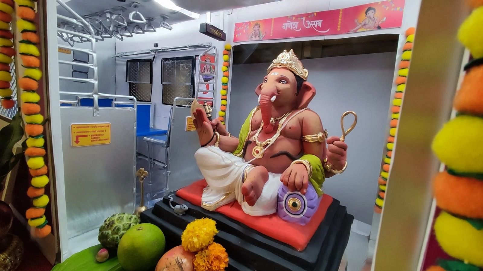 <div class="paragraphs"><p>Ganesha idol in miniature metro rail coach.</p></div>