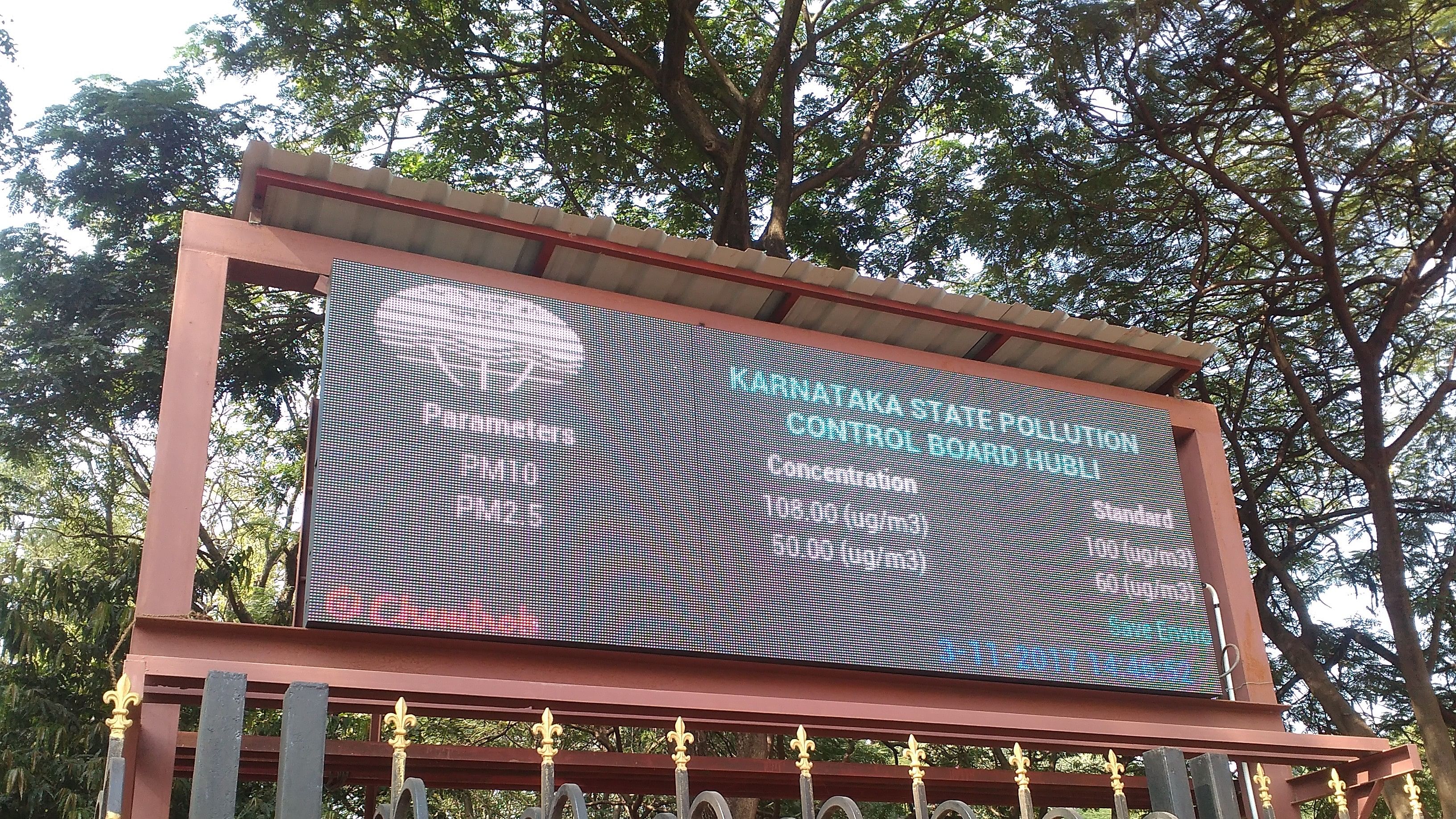 <div class="paragraphs"><p>A board showing the Karnataka State Pollution Control Board logo.</p></div>