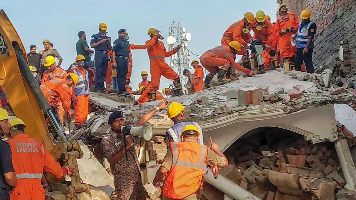 <div class="paragraphs"><p>Rescue operation underway after a three-storey building in the Fatehpur area collapsed, in Barabanki district, Monday.</p></div>
