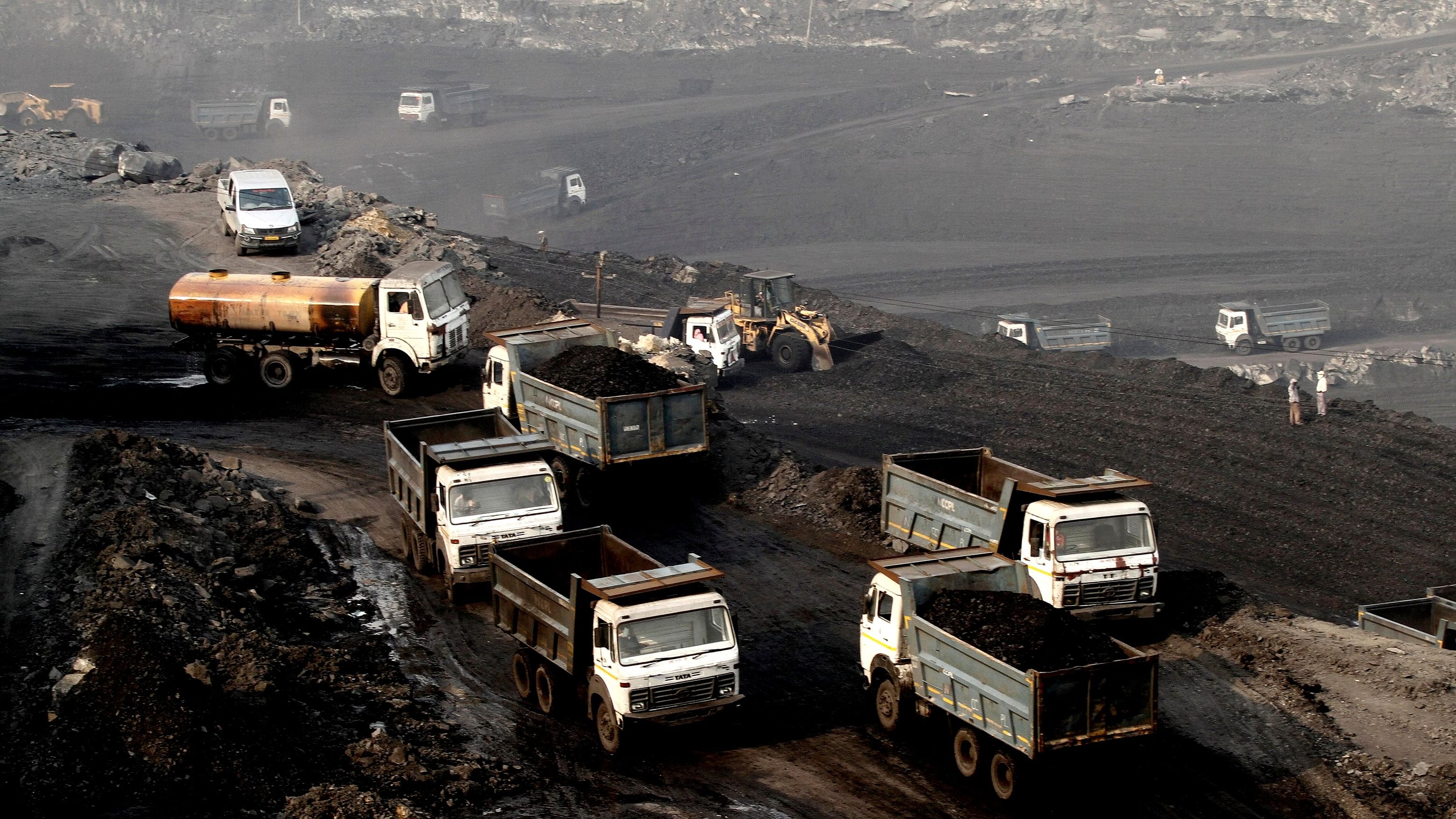<div class="paragraphs"><p>Trucks move in the Mahanadi coal fields, near Talcher town in Odisha, India. </p></div>