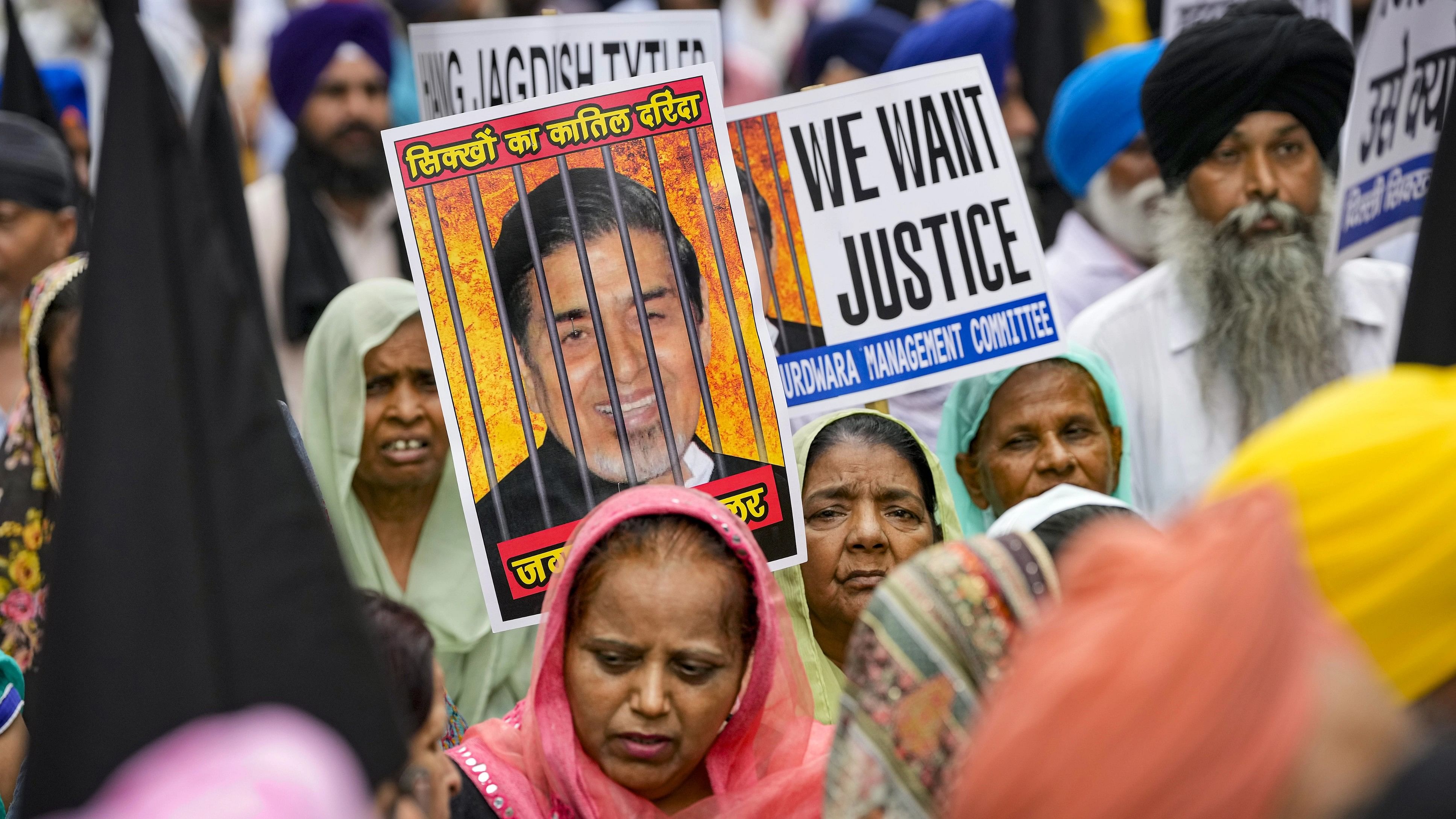 <div class="paragraphs"><p>Victims of the 1984 anti-Sikh riots stage a protest against Congress leader Jagdish Tytler outside the Rouse Avenue Court, in New Delhi, Saturday, Aug. 5, 2023. Tytler on Saturday appeared before the court in connection with the 1984 anti-Sikh riots case. </p></div>