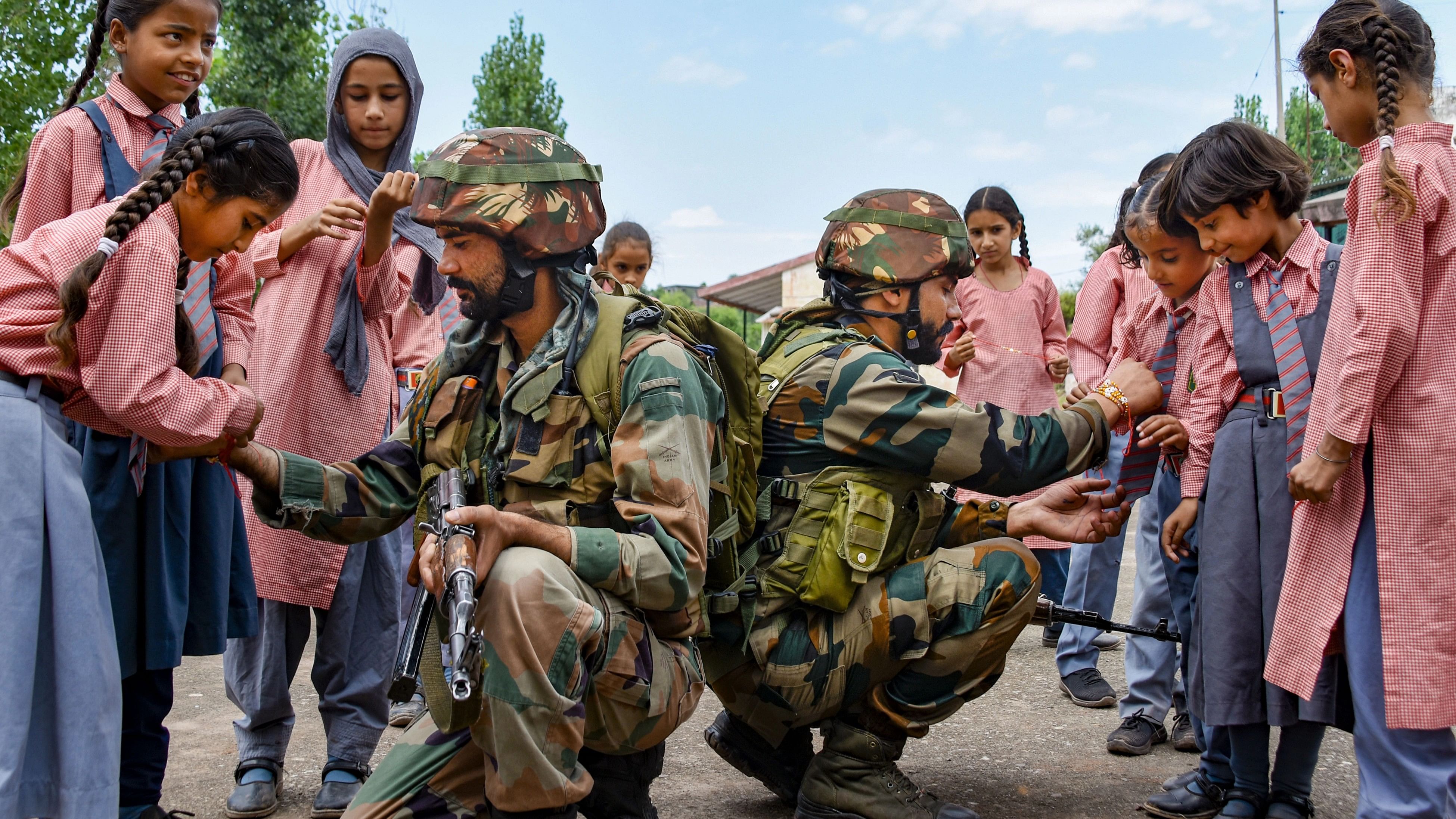 <div class="paragraphs"><p>School girls tie 'rakhi' on the wrists of Indian Army soldiers during celebrations of 'Raksha Bandhan' festival, in Poonch, Tuesday, Aug. 29, 2023. </p></div>