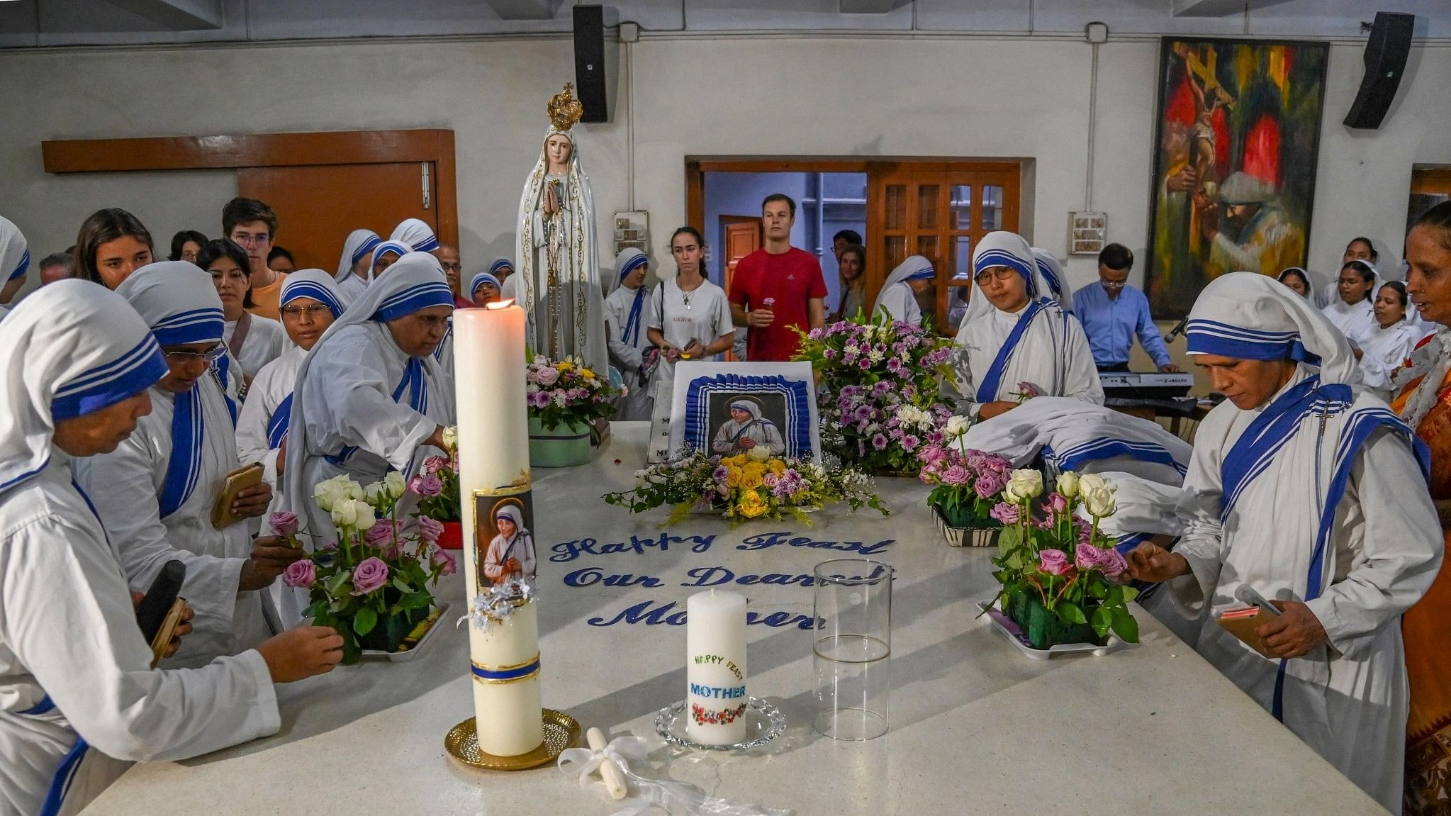 <div class="paragraphs"><p>Nuns of Missionaries of Charity decorate the tomb of Mother Teresa on her 26th death anniversary, in Kolkata, Tuesday, Sept. 5, 2023.</p></div>