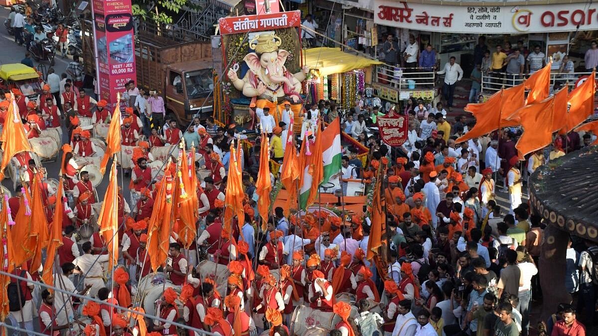 <div class="paragraphs"><p>Devotees celebrating with an idol of Lord Ganesha in Nagpur.</p></div>