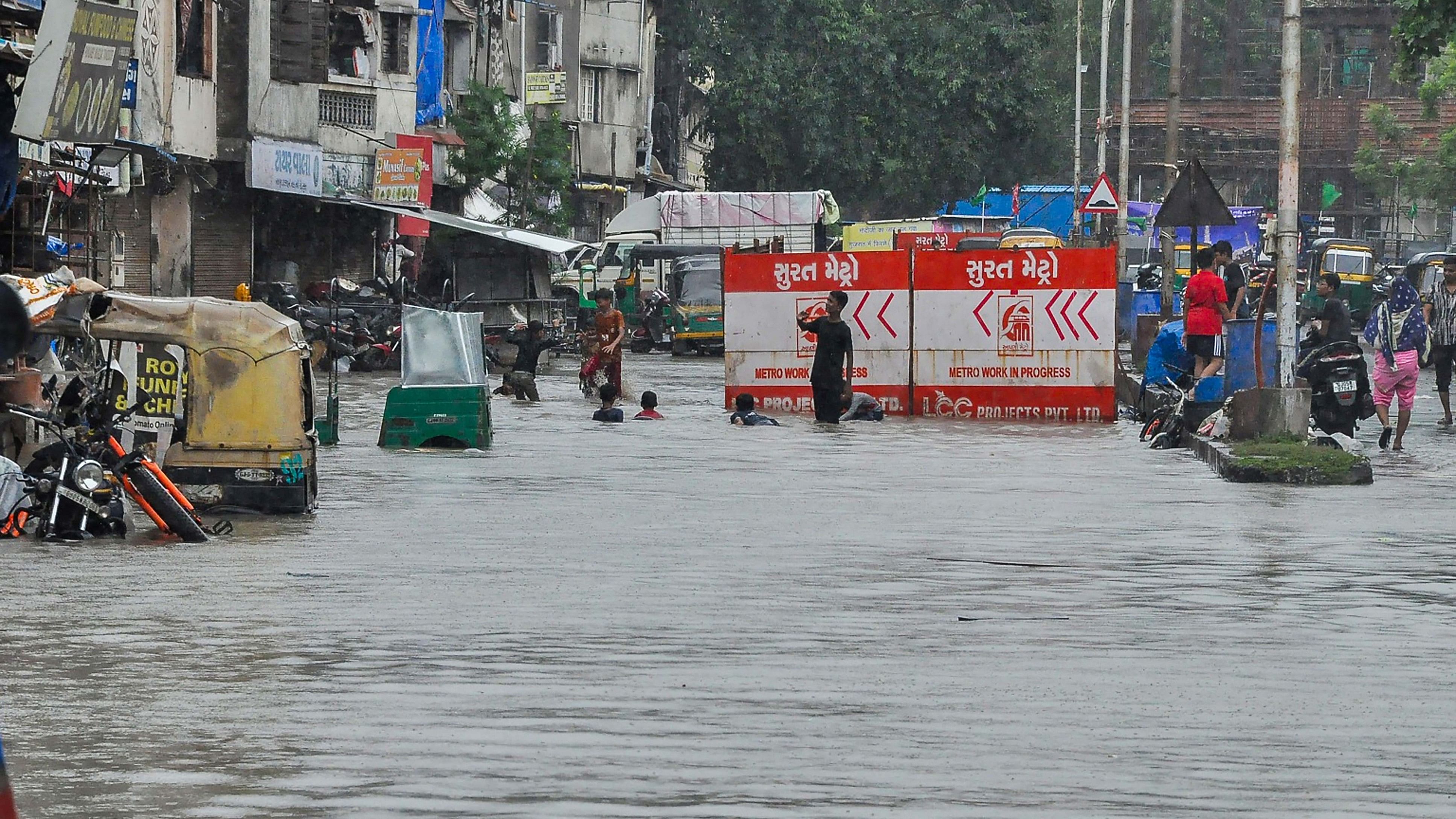 <div class="paragraphs"><p> A locality flooded by the Tapi river after release of water from the Ukai Dam, in Surat, Monday, Sept. 18, 2023.</p></div>