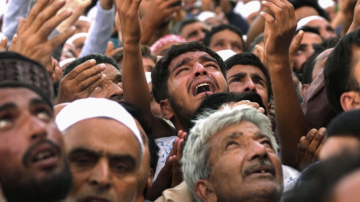 <div class="paragraphs"><p>Muslim devotees pray while having a glimpse of holy relic on the occasion of Eid-e-Milad-un-Nabi at Hazratbal shrine, in Srinagar.</p></div>