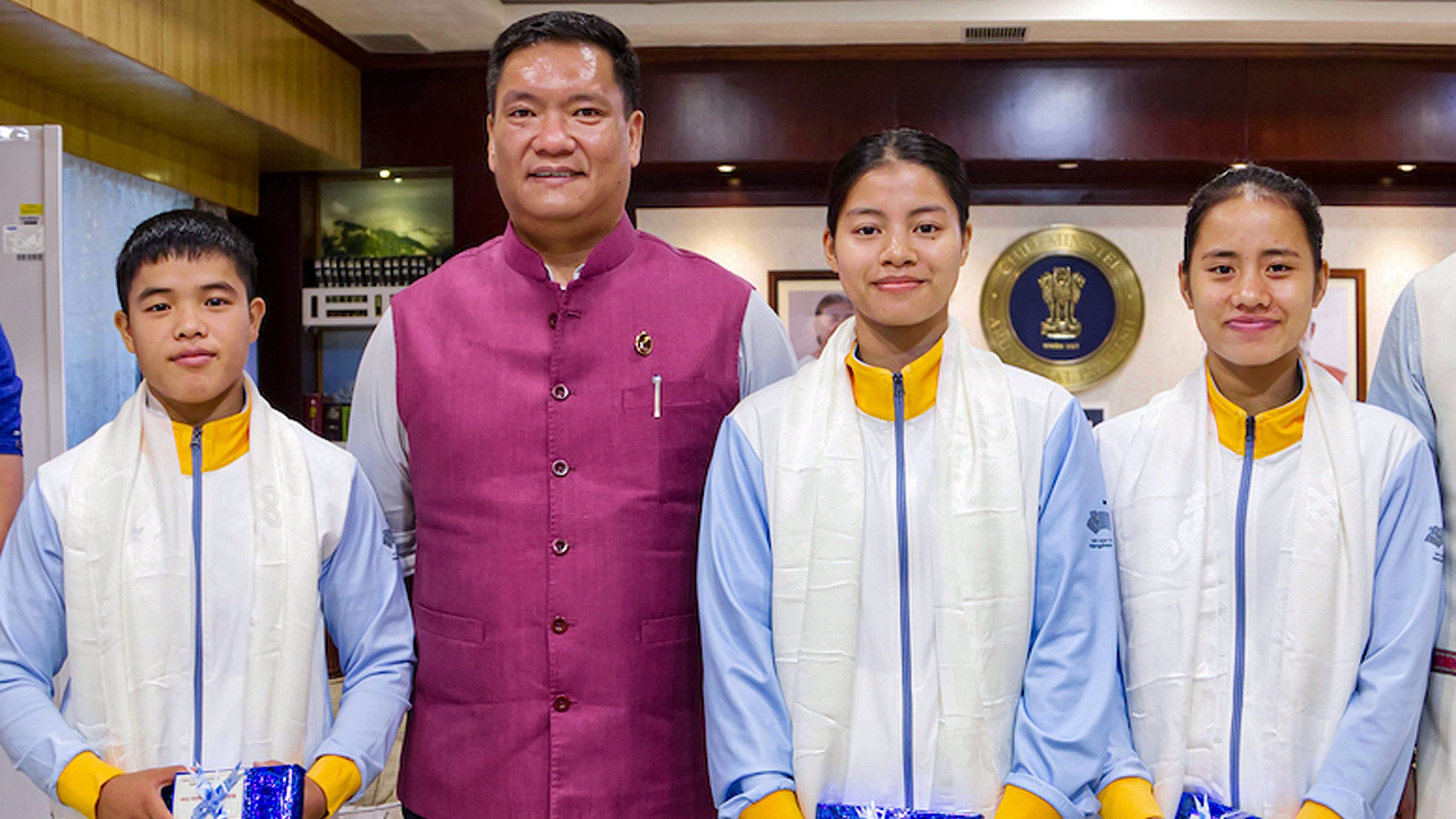 <div class="paragraphs"><p>Arunachal Pradesh Chief Minister Pema Khandu poses for a photograph with three Wushu players of the state who missed the ongoing 19th Asian Games.</p></div>