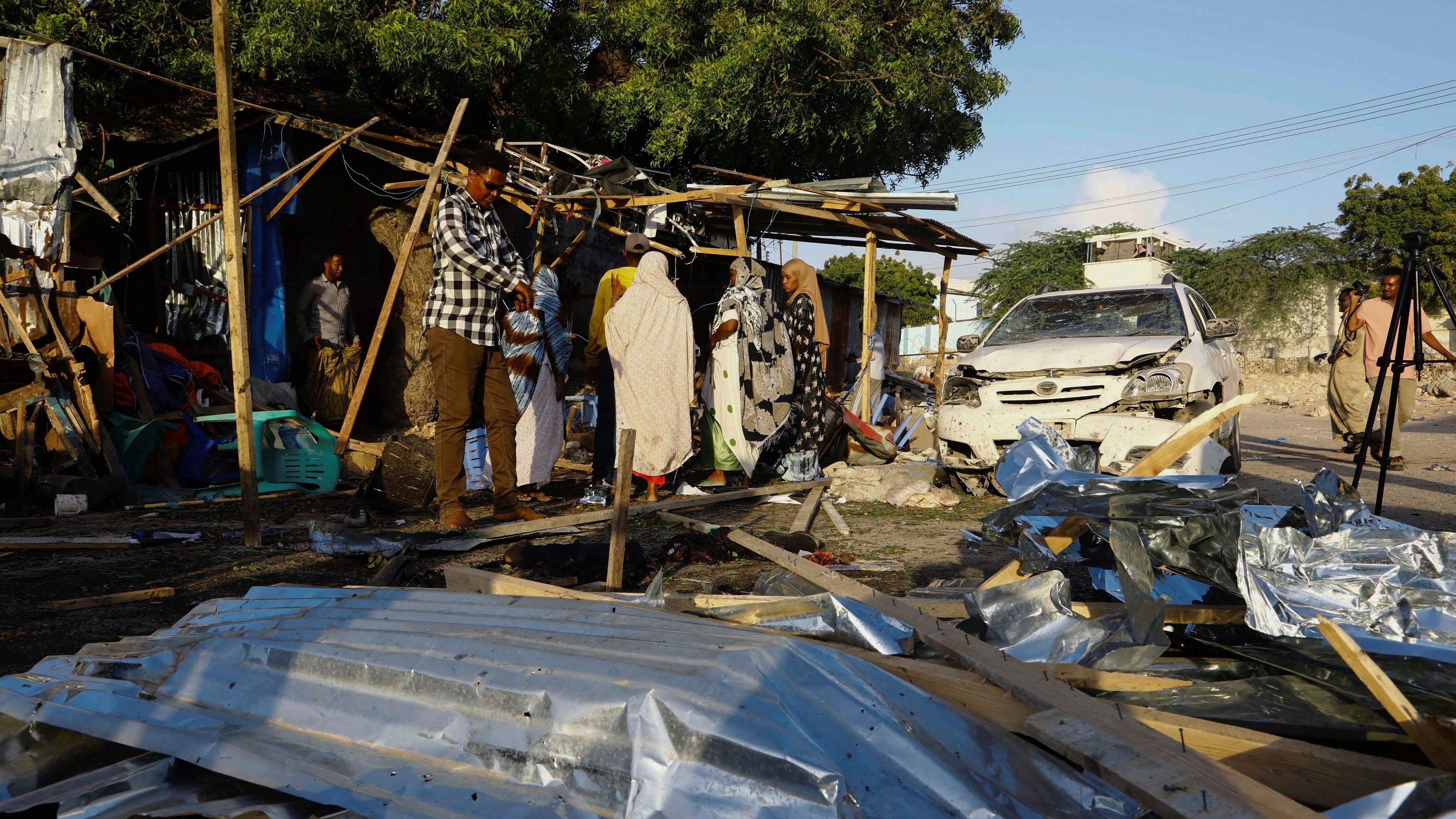 <div class="paragraphs"><p>Wreckages of vehicles are seen at scene of an explosion claimed to be set off by a suspected member of al Qaeda-linked al Shabaab, at a shop selling tea near a security checkpoint on a road leading to the parliament and the president's office in Mogadishu, Somalia September 29, 2023. </p></div>