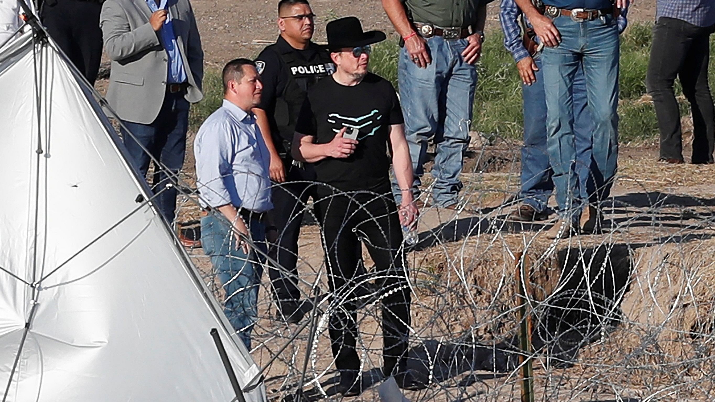 <div class="paragraphs"><p>Elon Musk views the Rio Grande river during a visit to Eagle Pass, Texas, US as migrants continue crossing into the US to seek asylum, as seen from Piedras Negras, Mexico.</p></div>