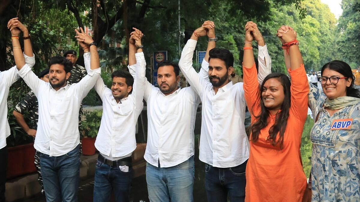 <div class="paragraphs"><p>ABVP's Tushar Dedha (president), Aparajita (secretary) and Sachin Baisla (joint secretary) and others after they won in the DUSU election 2023.</p></div>