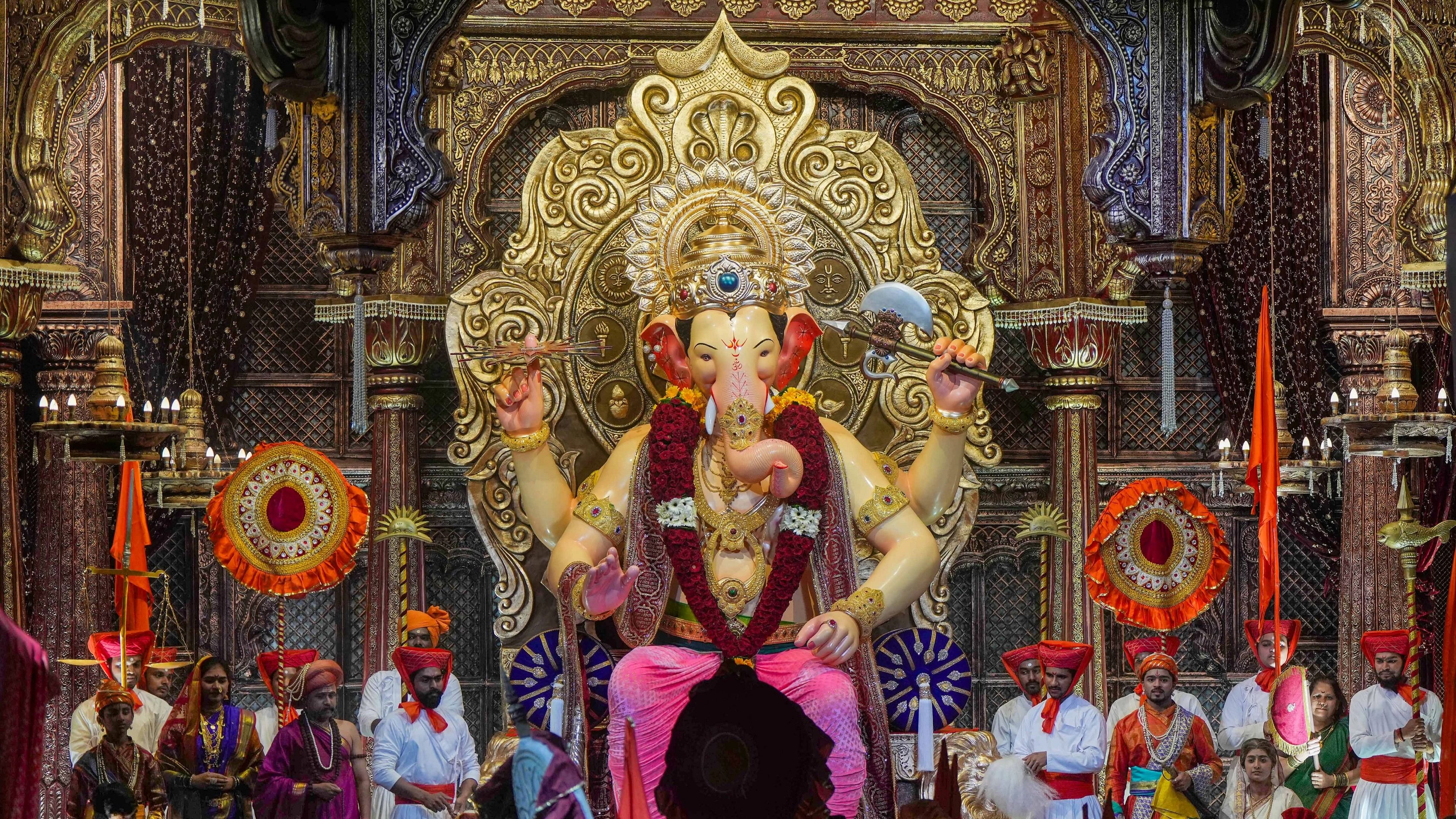 Mumbai: Devotees gather to take the first look at the unveiling of the idol of Lord Ganesha of Lalbaugcha Raja Ganesh Mandal, in Mumbai, Friday, Sept. 15, 2023. (PTI Photo/Shashank Parade)(PTI09_15_2023_000367B)