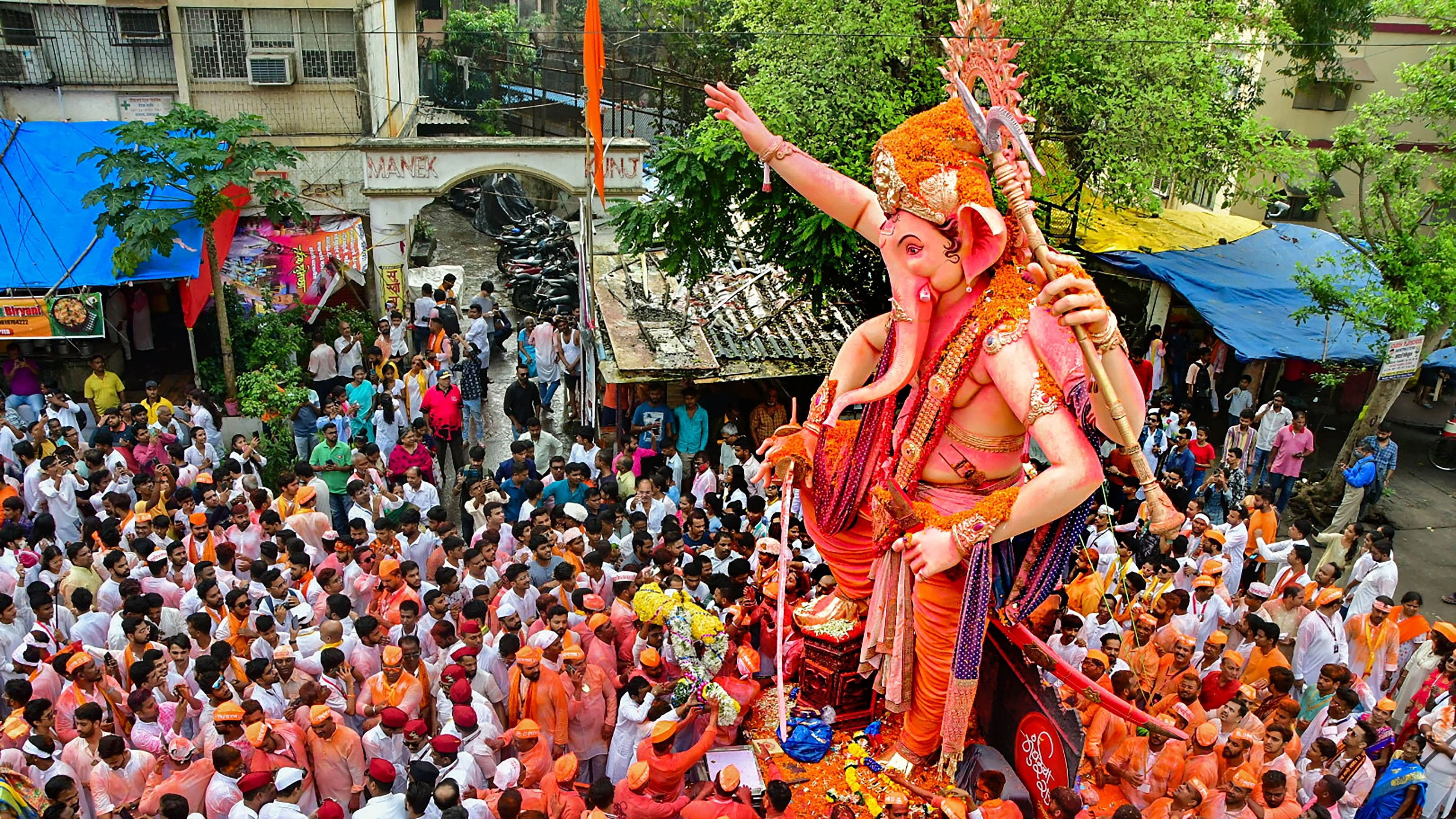 <div class="paragraphs"><p>Devotees take part in a procession for immersion (visarjan) of Lord Ganesha's idol during 'Ganesh Chaturthi' festivities, in Mumbai.</p></div>