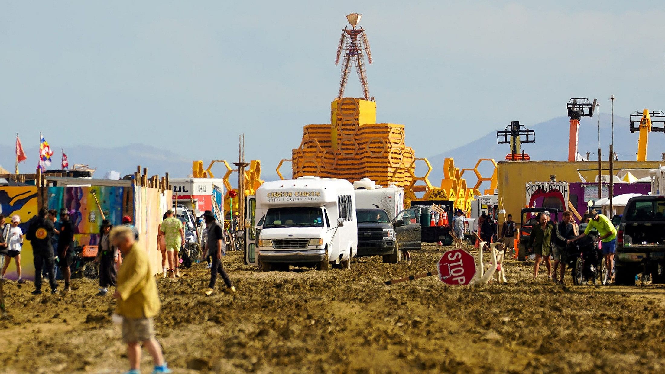 <div class="paragraphs"><p>The Man structure, which is normally burned on Saturday night, looms over the Burning Man encampment after a severe rainstorm left tens of thousands of revelers attending the annual festival stranded in mud in Black Rock City, in the Nevada desert September 3, 2023.</p></div>