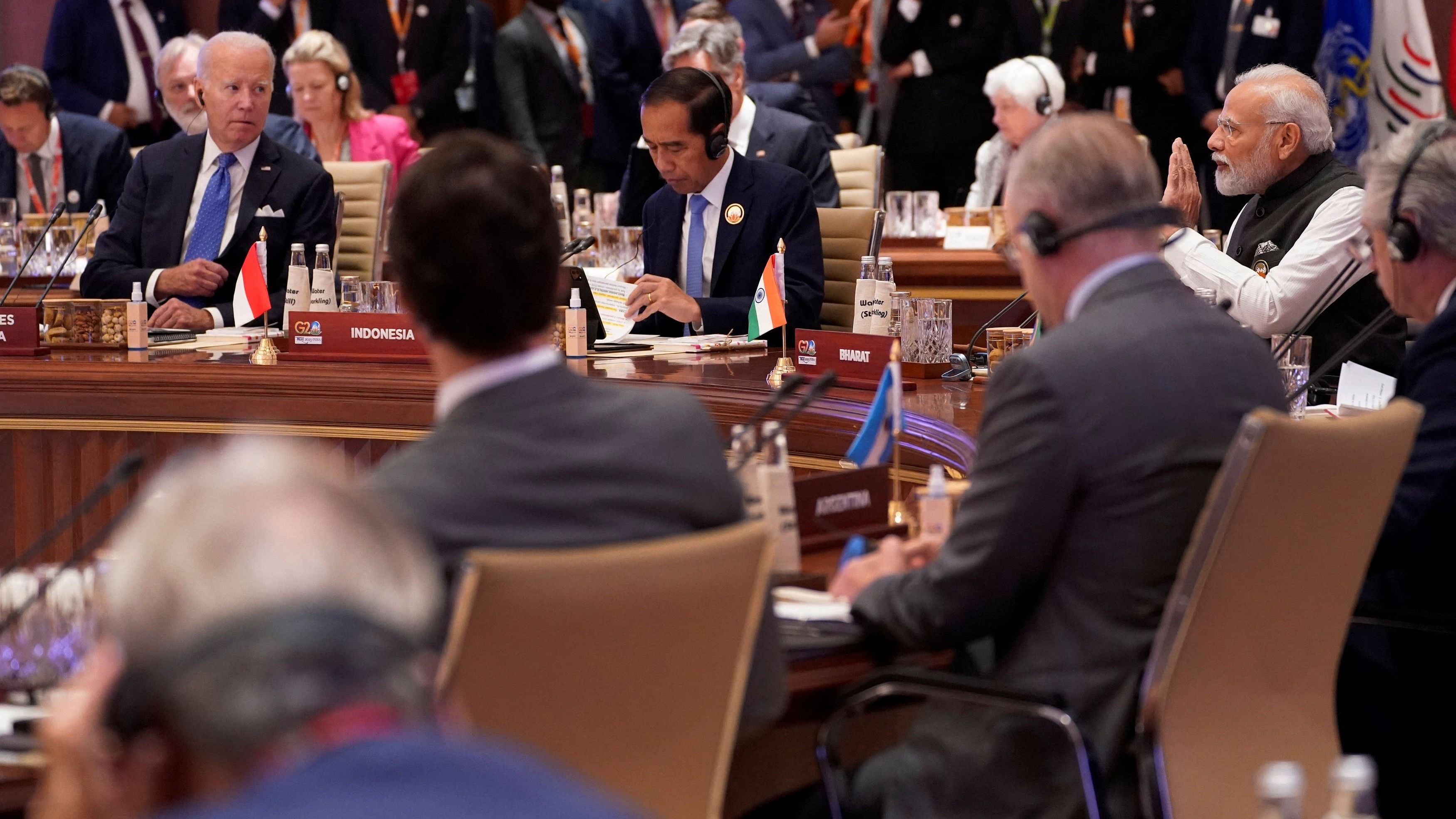 <div class="paragraphs"><p>Prime Minister Narendra Modi speaks as US President Joe Biden with other leaders listen during the first session of the G20 Summit, in New Delhi.</p></div>