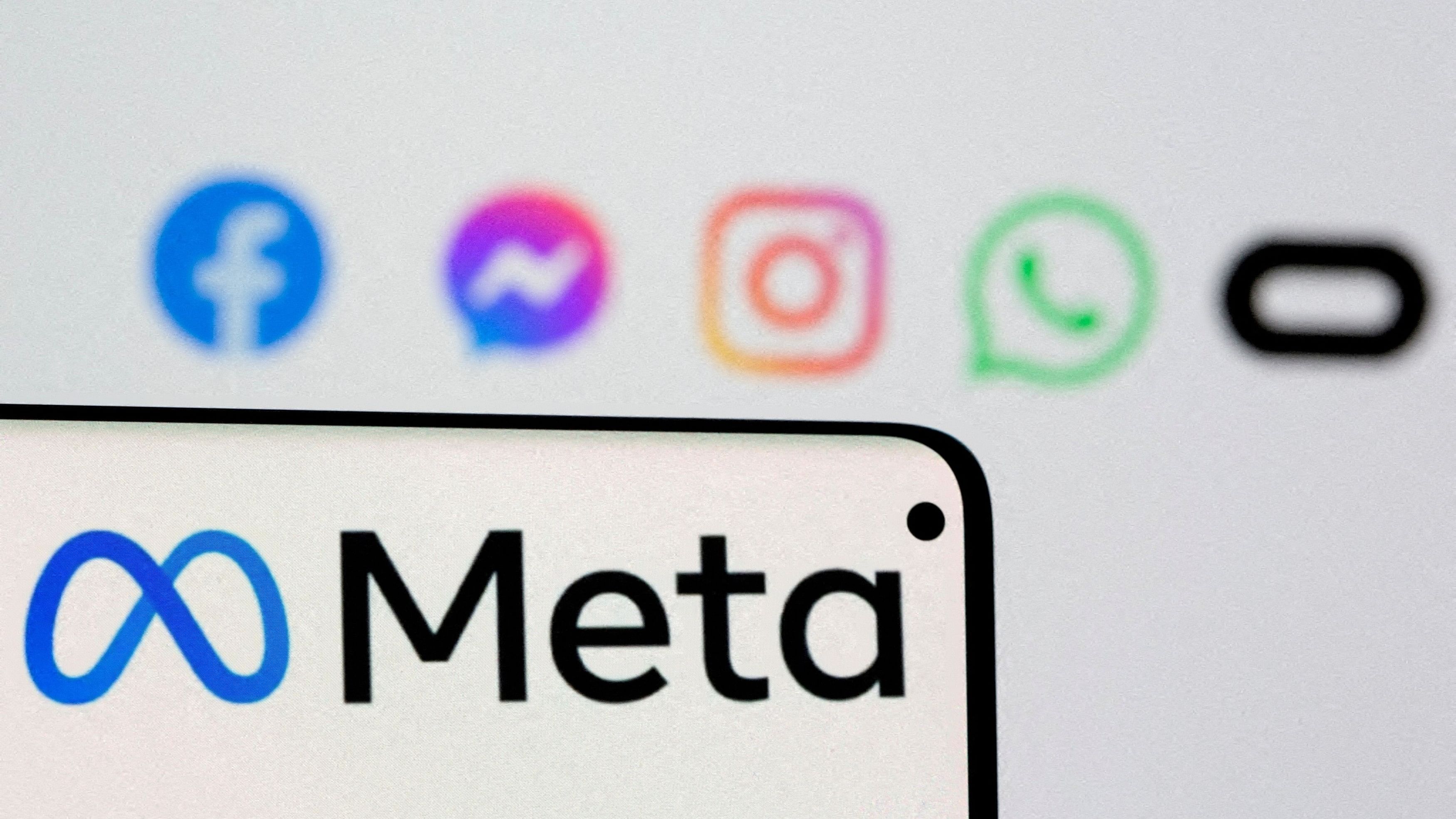 <div class="paragraphs"><p>The logo of Meta is seen on a smartphone in front of displayed logos of Facebook, Messenger, Instagram, Whatsapp and Oculus in this illustration picture taken October 28, 2021. </p></div>