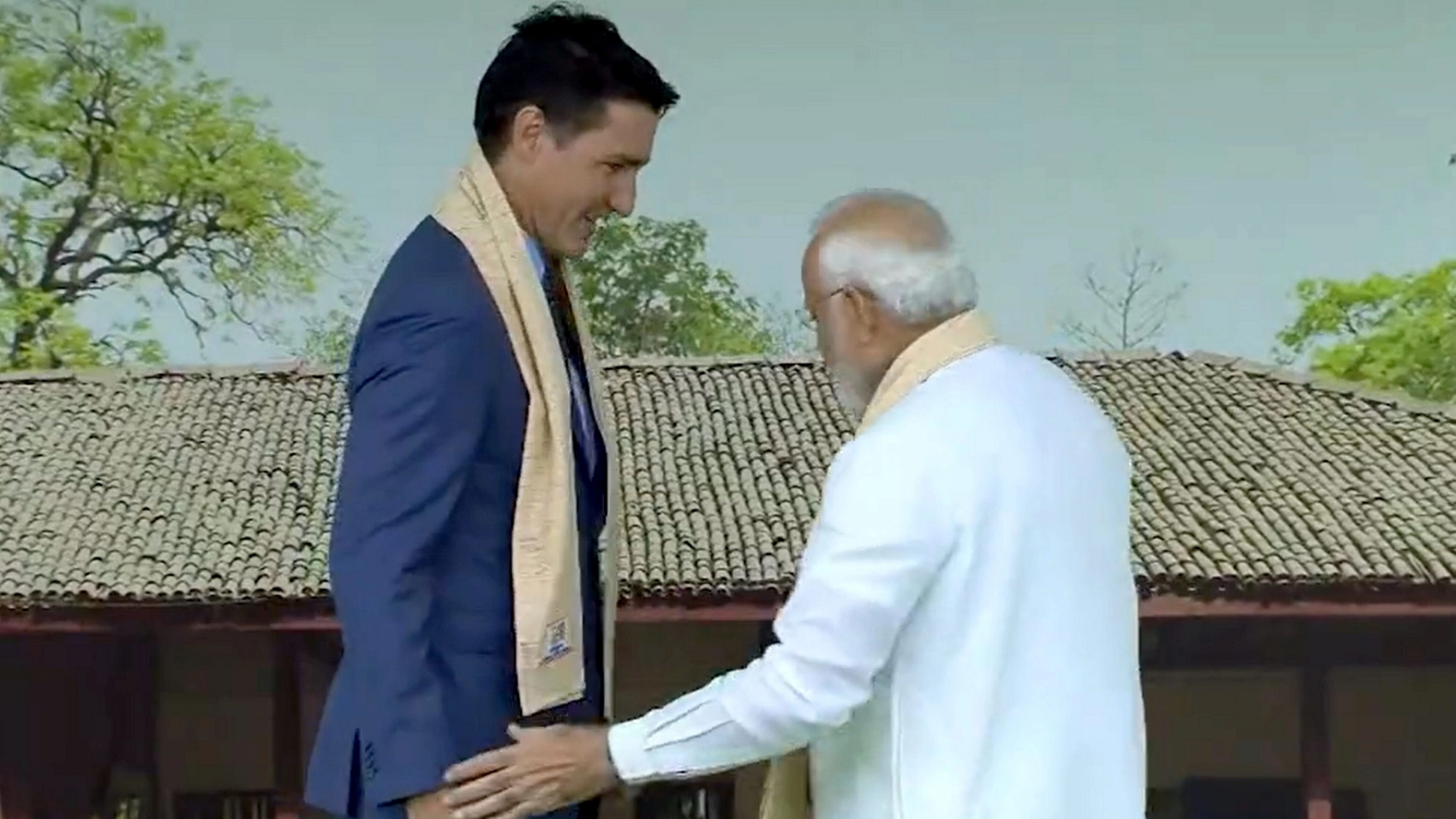 <div class="paragraphs"><p>Prime Minister Narendra Modi welcomes Canadian Prime Minister Justin Trudeau upon his arrival at the Rajghat on the final day of the G20 Summit in New Delhi.</p></div>