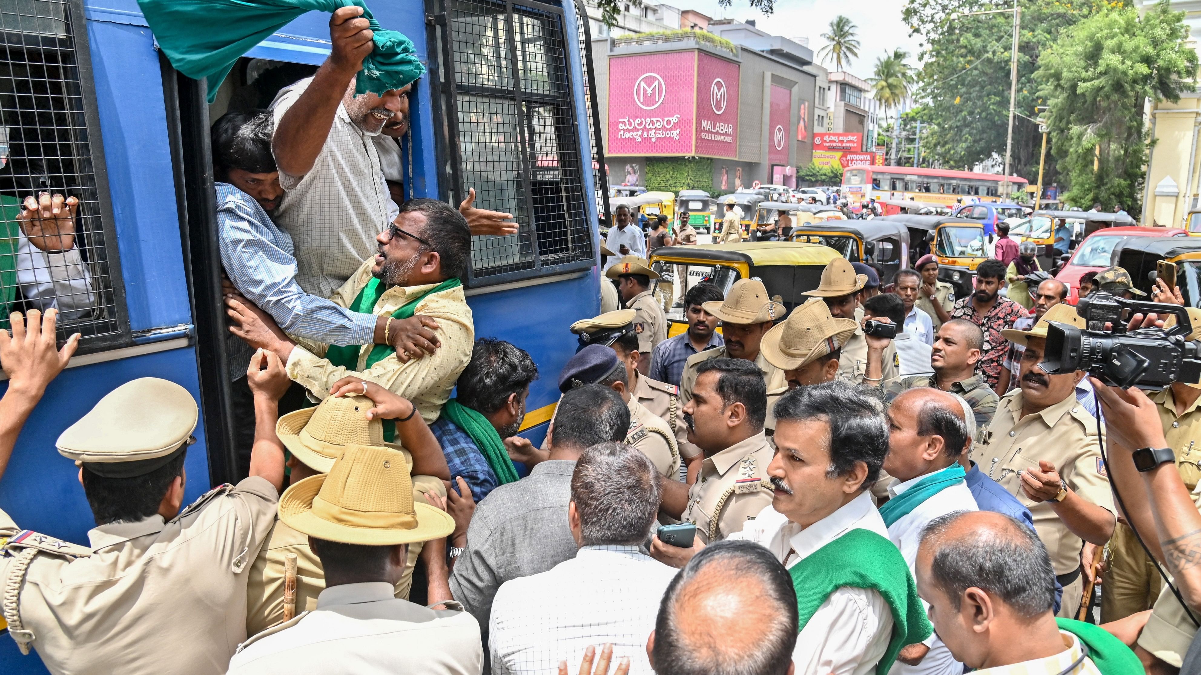 <div class="paragraphs"><p>Police detain farmers protesting against the release of Cauvery water to Tamil Nadu, in Mysuru on Tuesday. </p></div>
