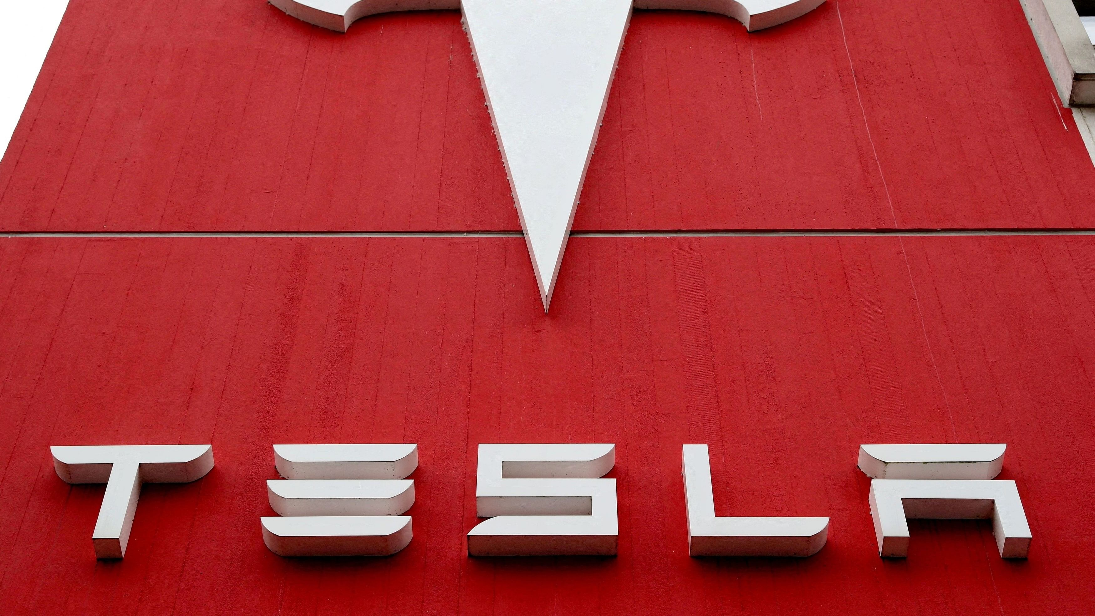<div class="paragraphs"><p>The logo of car manufacturer Tesla is seen at a branch office in Bern, Switzerland October 28, 2020. </p></div>
