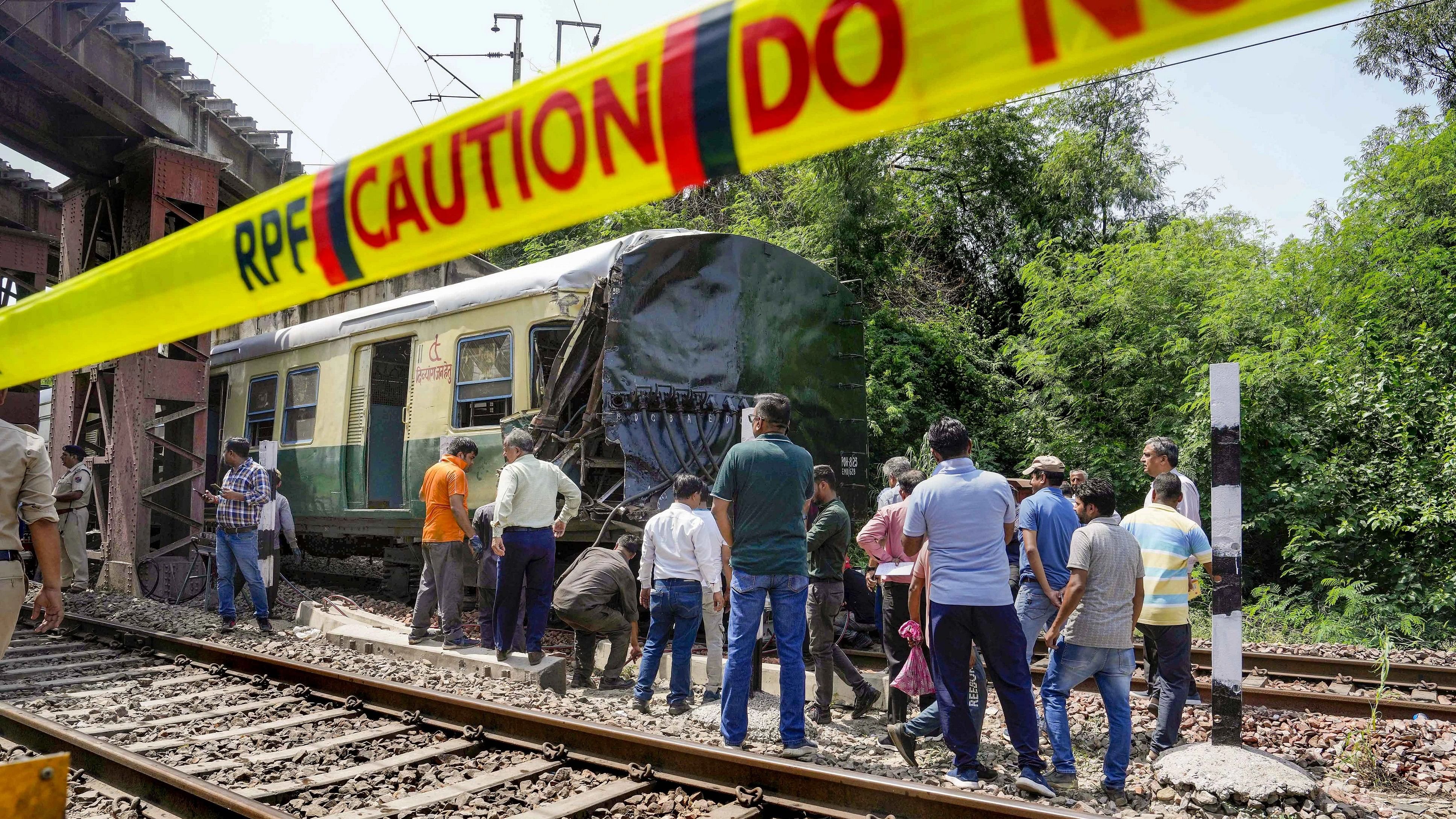 <div class="paragraphs"><p>Railway officials at the site after a coach of a local EMU train derailed in New Delhi.</p></div>