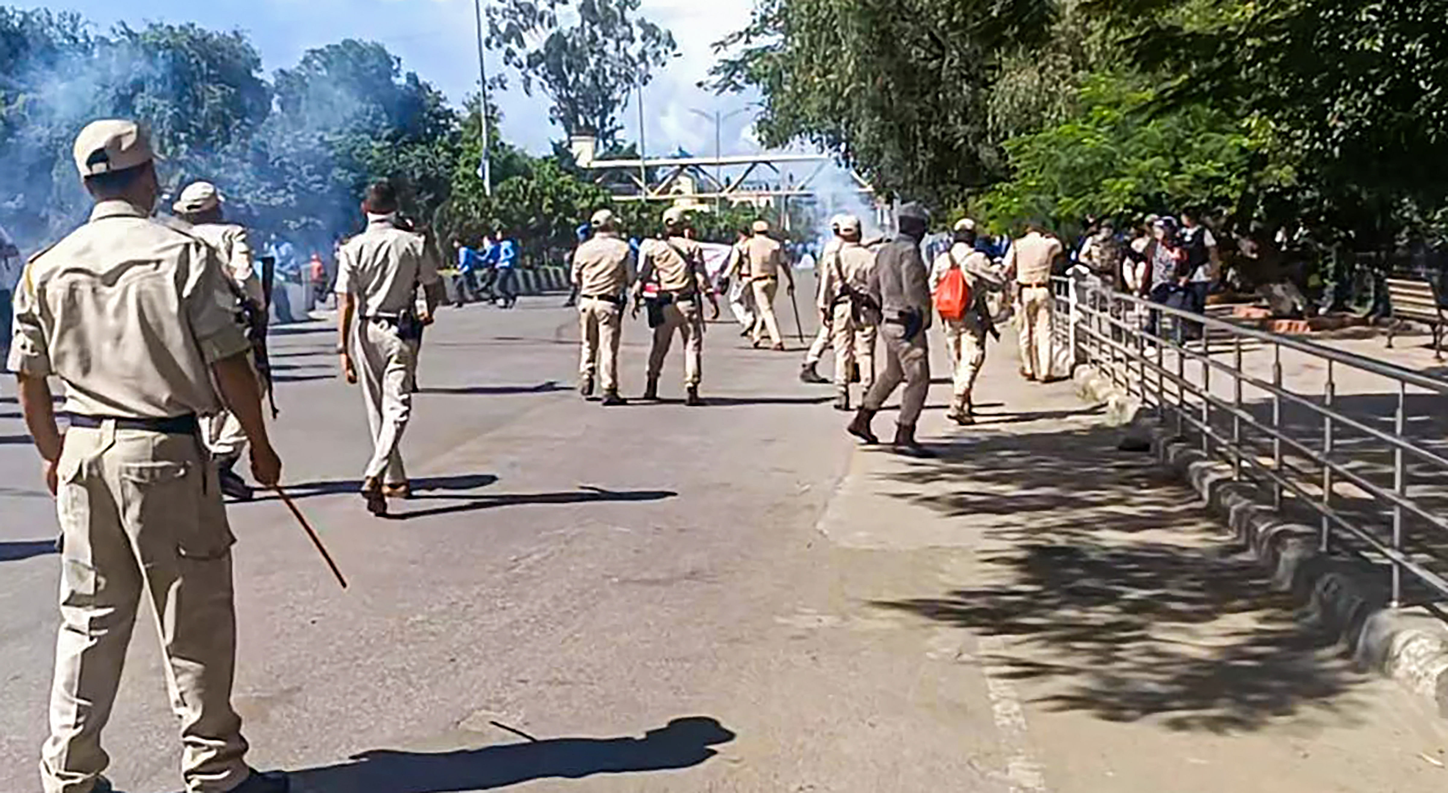 <div class="paragraphs"><p>Security personnel stand guard during a protest  in Imphal against the killing of two youths.</p></div>