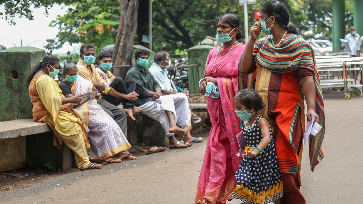 <div class="paragraphs"><p>People wear safety masks as a precautionary measure after the 'Nipah' virus outbreak, at Kozhikode Medical College, in Kerala, on Friday. </p></div>