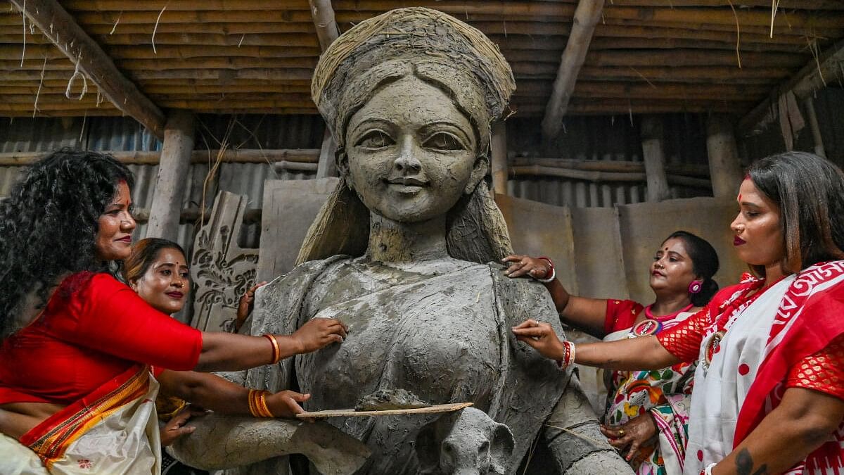 <div class="paragraphs"><p>Sex workers with an unfinished clay idol of Goddess Durga as they unveil it for the upcoming Durga Puja festival at Kumartuli studio in Kolkata.&nbsp;</p></div>