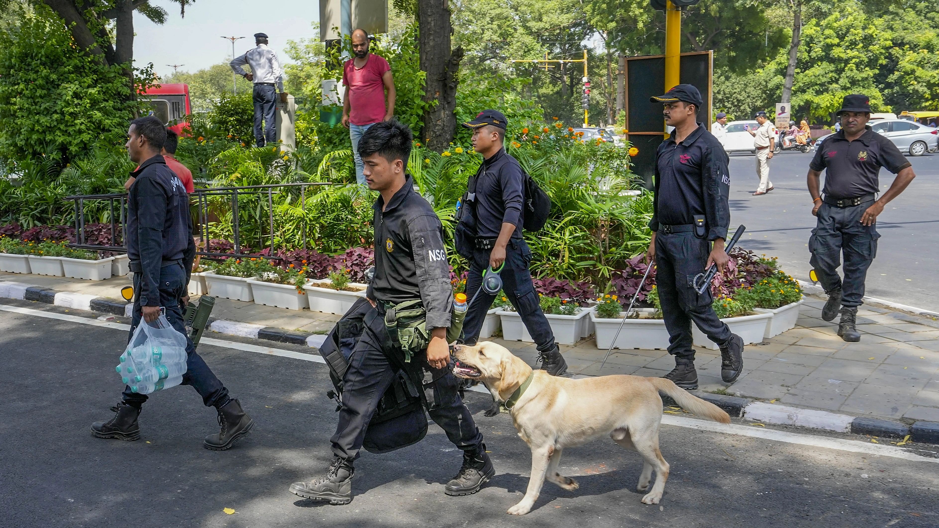 <div class="paragraphs"><p>New Delhi: Security personnel with a sniffer dog conduct security checks near Rajghat in preparation for the upcoming G20 Summit, in New Delhi, Monday, Sept. 4, 2023.</p></div>