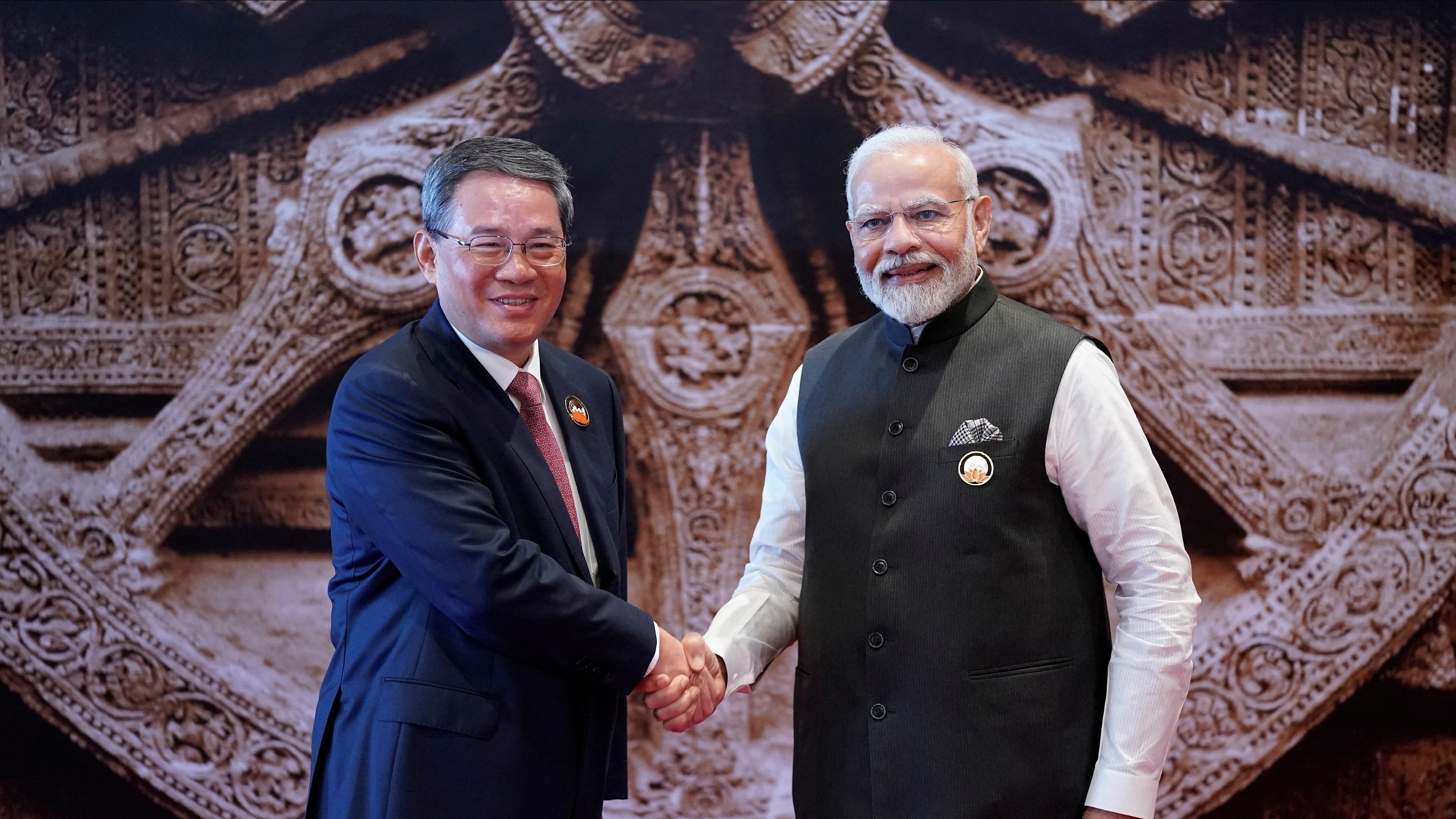 <div class="paragraphs"><p>Prime Minister Narendra Modi shakes hand with Chinese Premier Li Qiang  upon his arrival at Bharat Mandapam convention centre for the G20 Summit in New Delhi.</p></div>