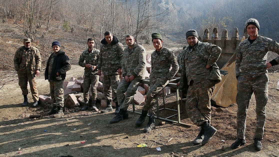 <div class="paragraphs"><p>Ethnic Armenian soldiers are seen in the village of Knaravan located in a territory which is soon to be turned over to Azerbaijan under a peace deal that followed the fighting over the Nagorno-Karabakh region. </p></div>