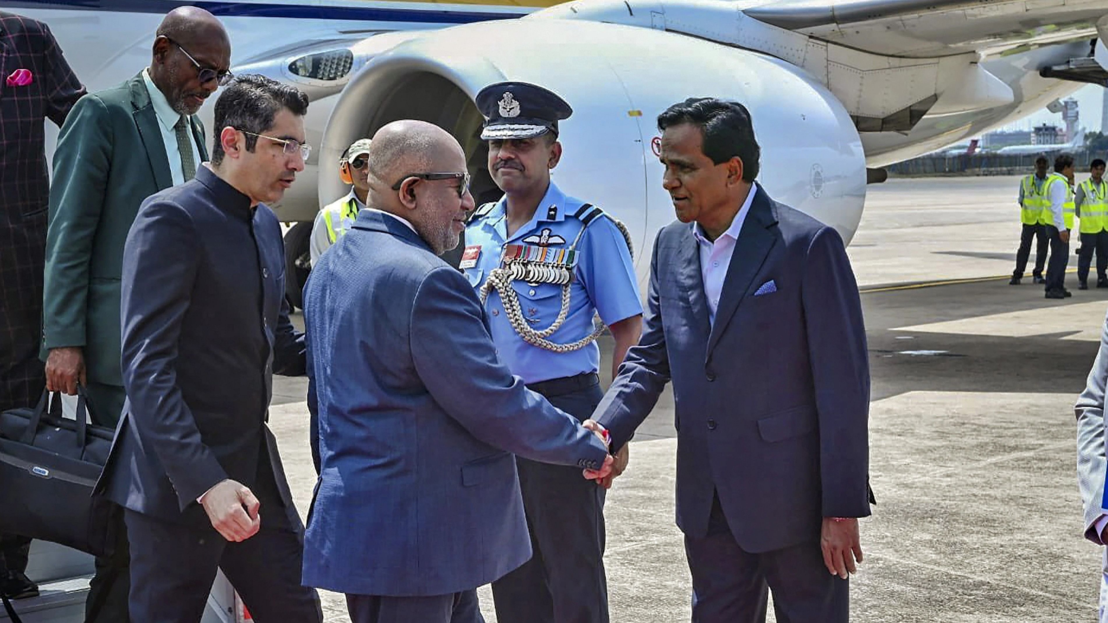 <div class="paragraphs"><p>President of the Union of Comoros and Chairperson of the African Union (AU) Azali Assoumani being welcomed by Union Minister of State for Railways, Coal and Mines Danve Raosaheb Dadarao upon his arrival at Palam Airforce Airport ahead of the G20 Summit, in New Delhi, Friday, Sept. 8, 2023. </p></div>