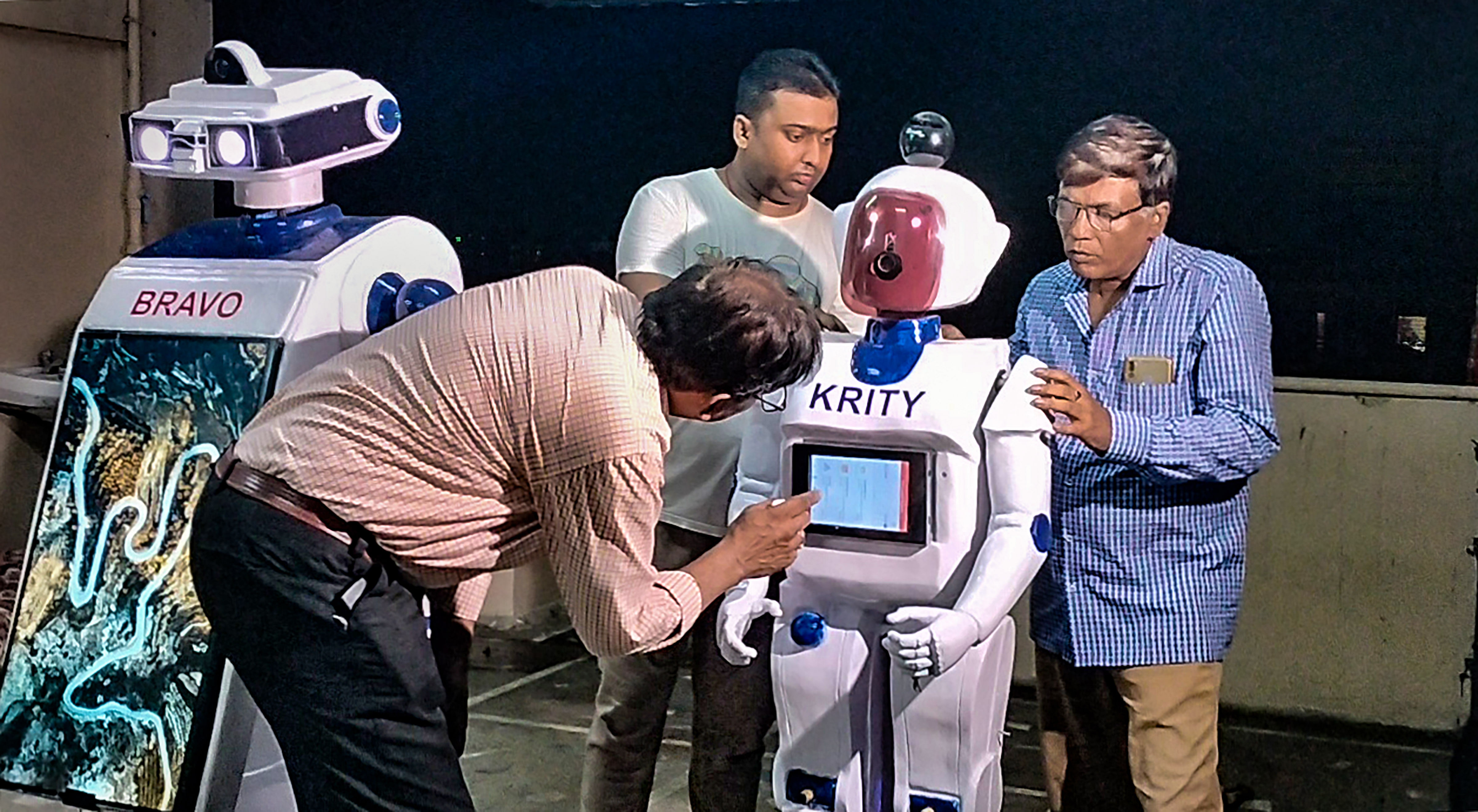 <div class="paragraphs"><p>Howrah: Atanu Ghosh with two robots 'Bravo' and 'Krity' that can help autistic children learn, in Howrah.</p></div>