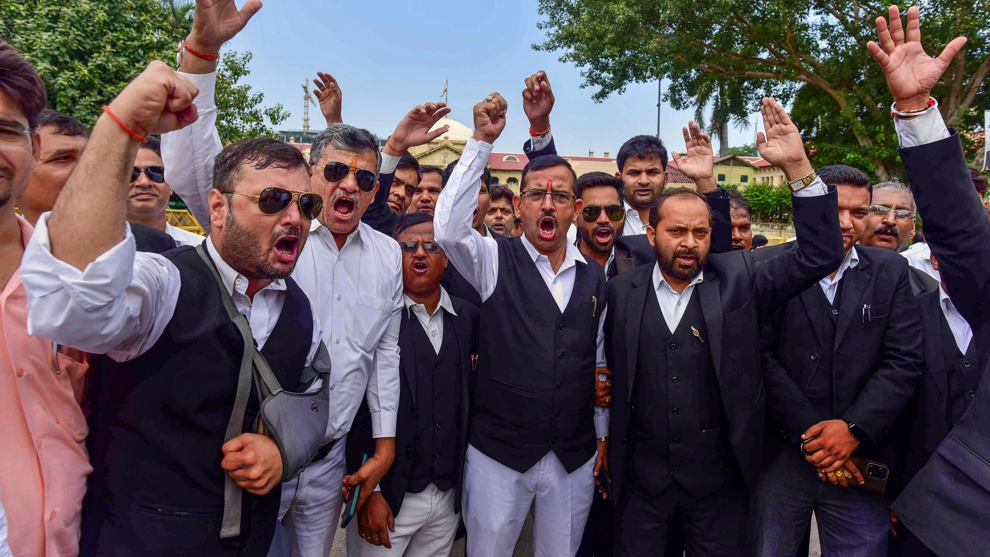 <div class="paragraphs"><p> Lawyers of Allahabad High Court raise slogans during a protest over the alleged police lathi-charge on advocates in Hapur.</p></div>