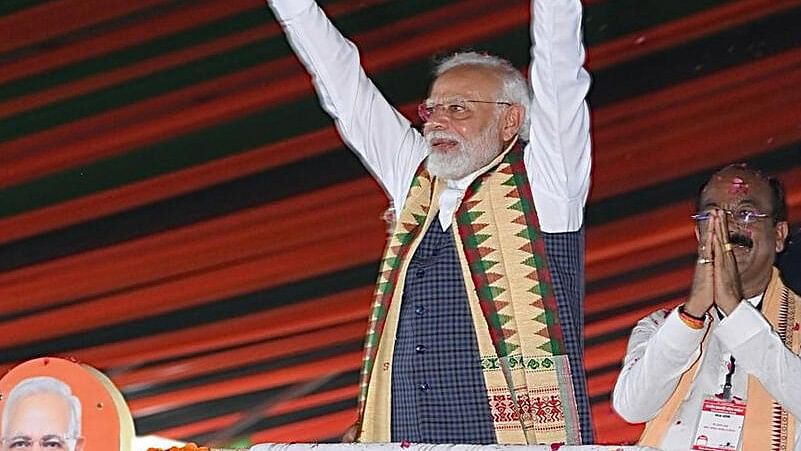 <div class="paragraphs"><p>Prime Minister Narendra Modi with Chhattisgarh BJP President Arun Sao waves at supporters as he arrives for the 'Parivartan Mahasankalp' rally, in Bilaspur.</p></div>