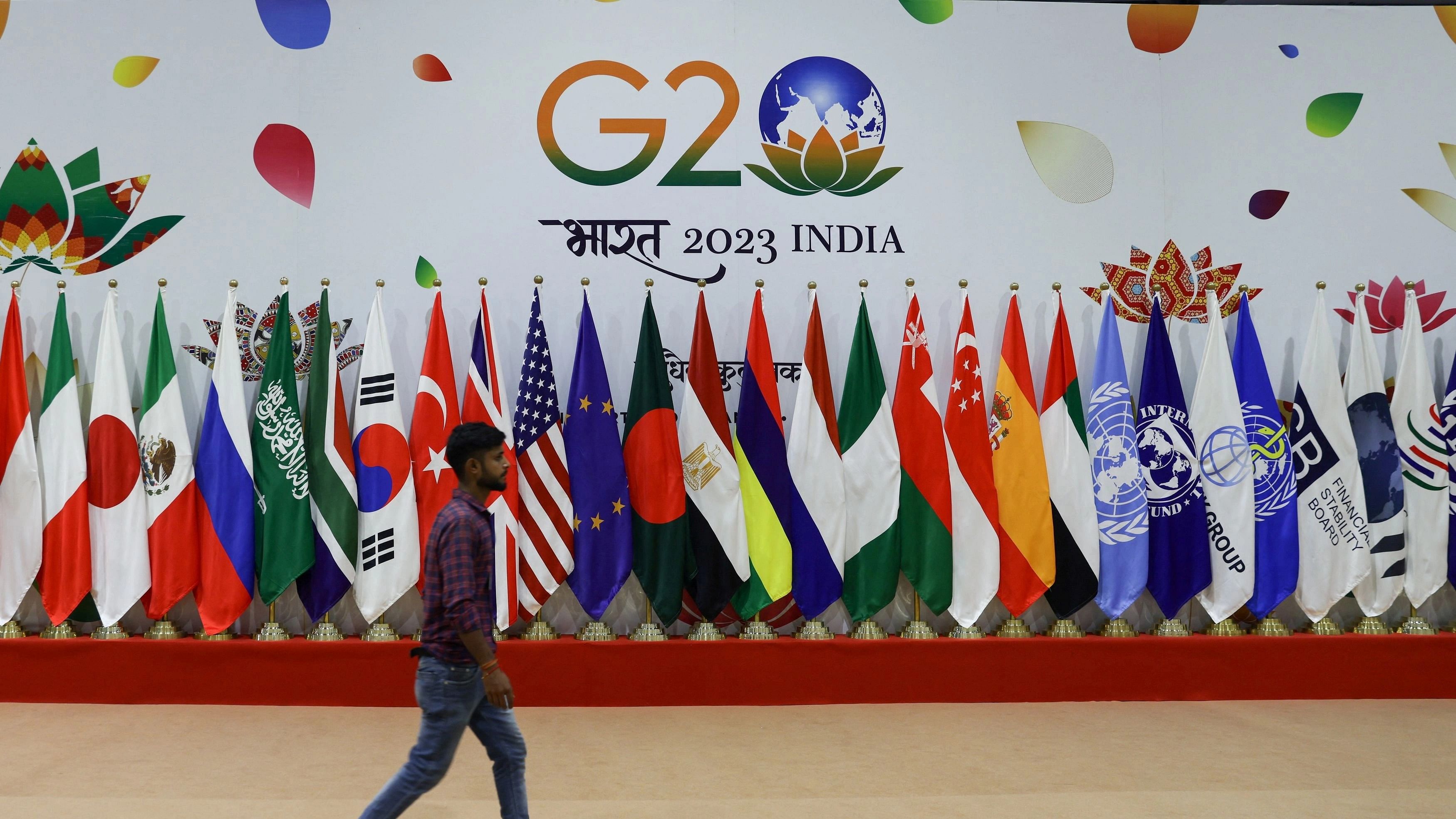 <div class="paragraphs"><p>A man walks near flags ahead of G20 Summit in New Delhi, India, September 8, 2023.</p></div>