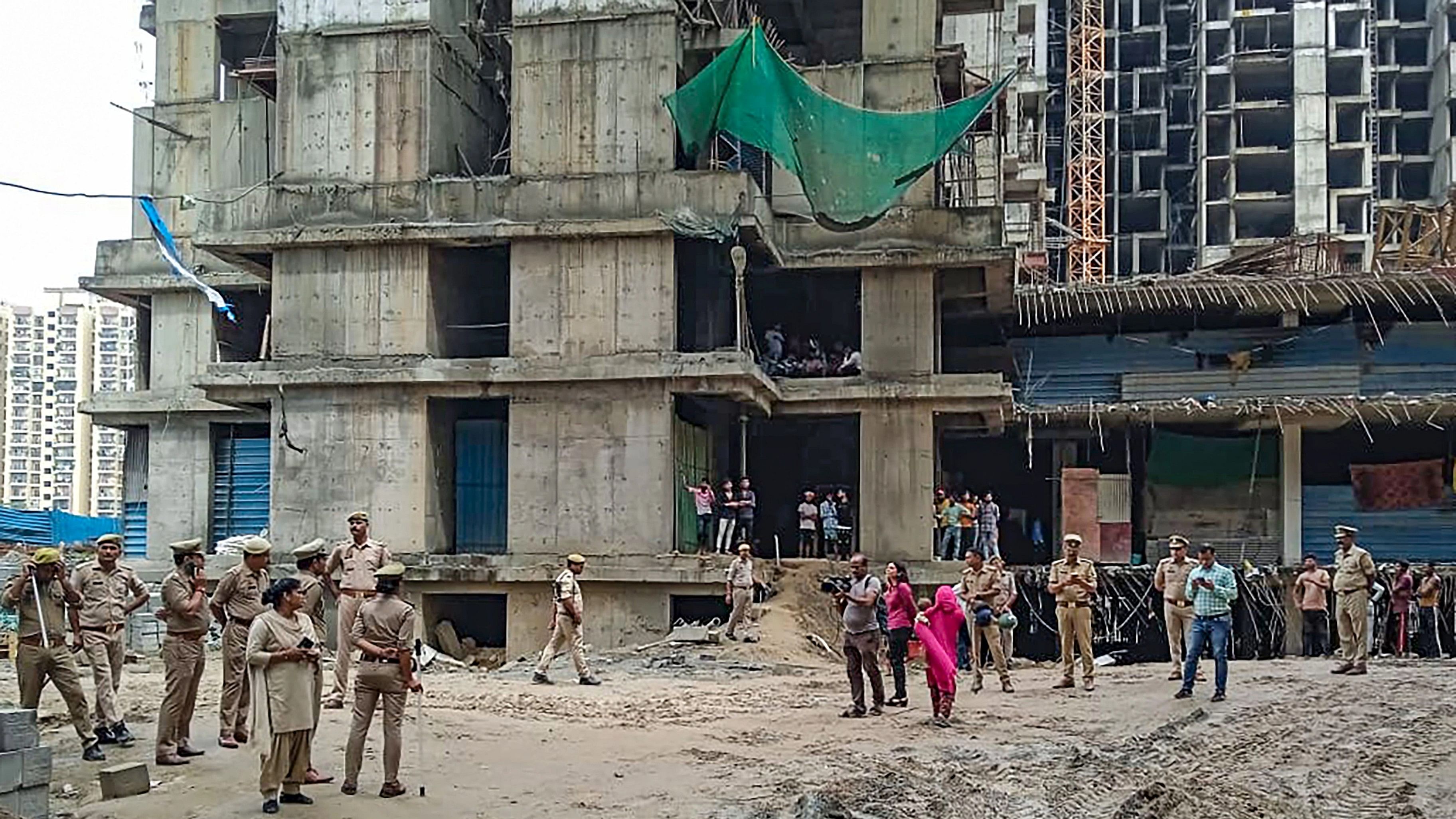 <div class="paragraphs"><p>Police personnel at the site after a lift in an under-construction building collapsed, in Greater Noida, Friday, Sept. 15, 2023. </p></div>